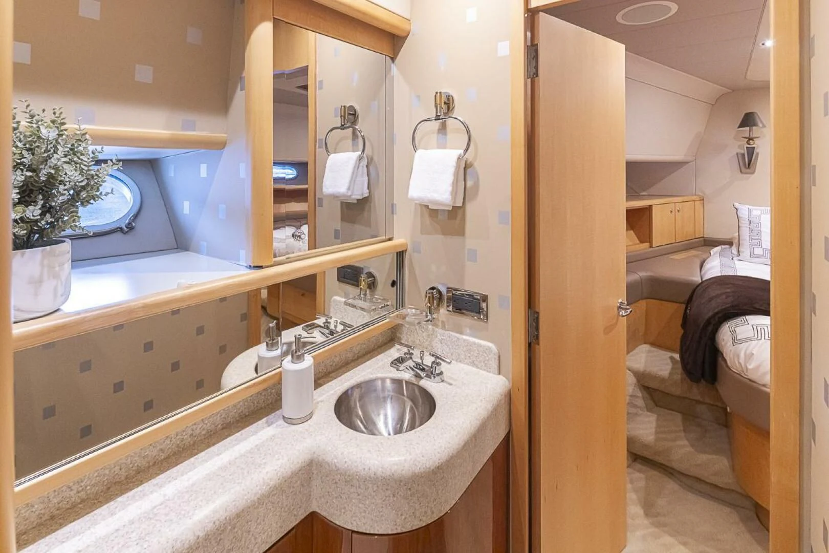 a bathroom with a sink and a mirror aboard SEA SPUR Yacht for Sale