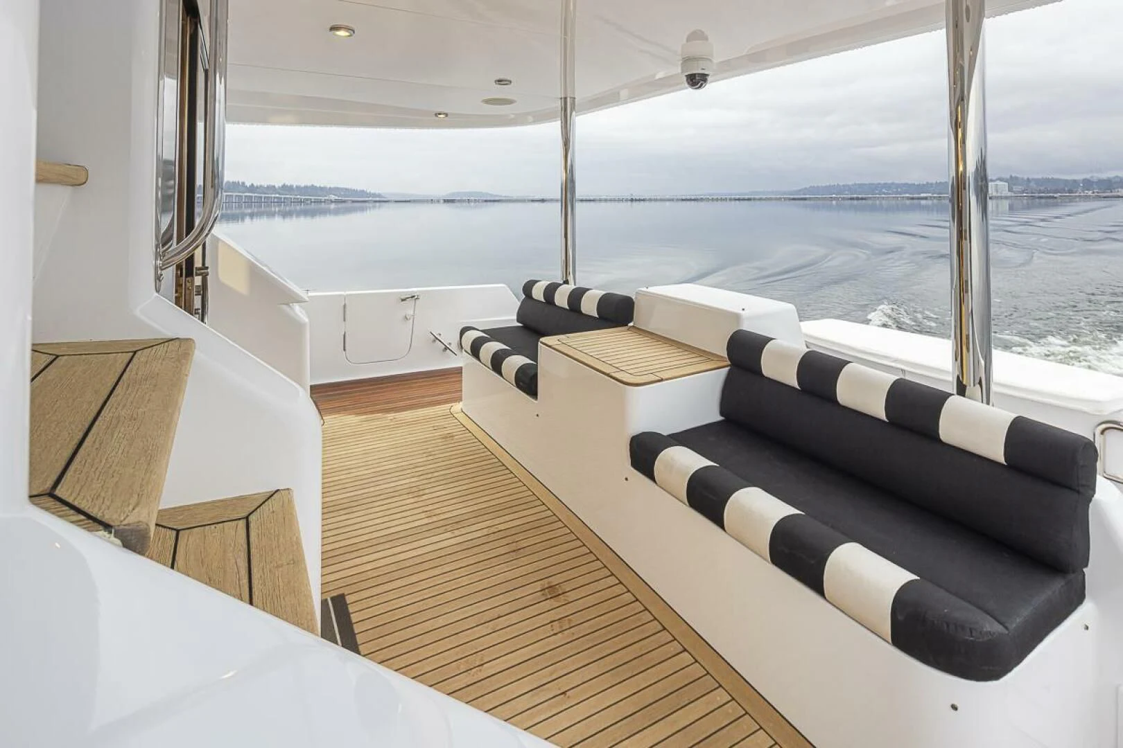 a room with a couch and a table and a window aboard SEA SPUR Yacht for Sale