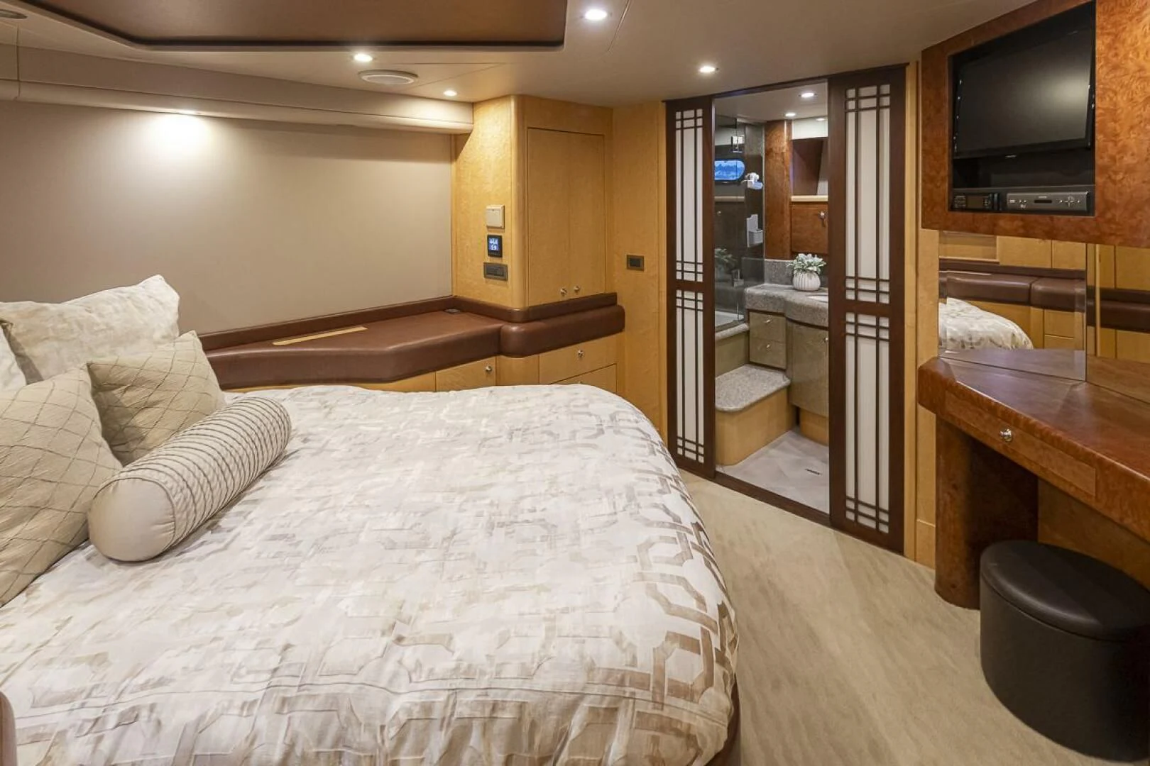 a hotel room with a bed and tv aboard SEA SPUR Yacht for Sale