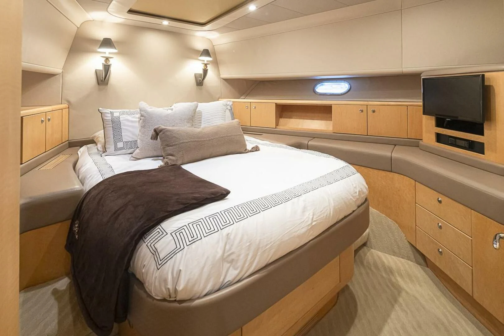 a room with a bed and a television aboard SEA SPUR Yacht for Sale