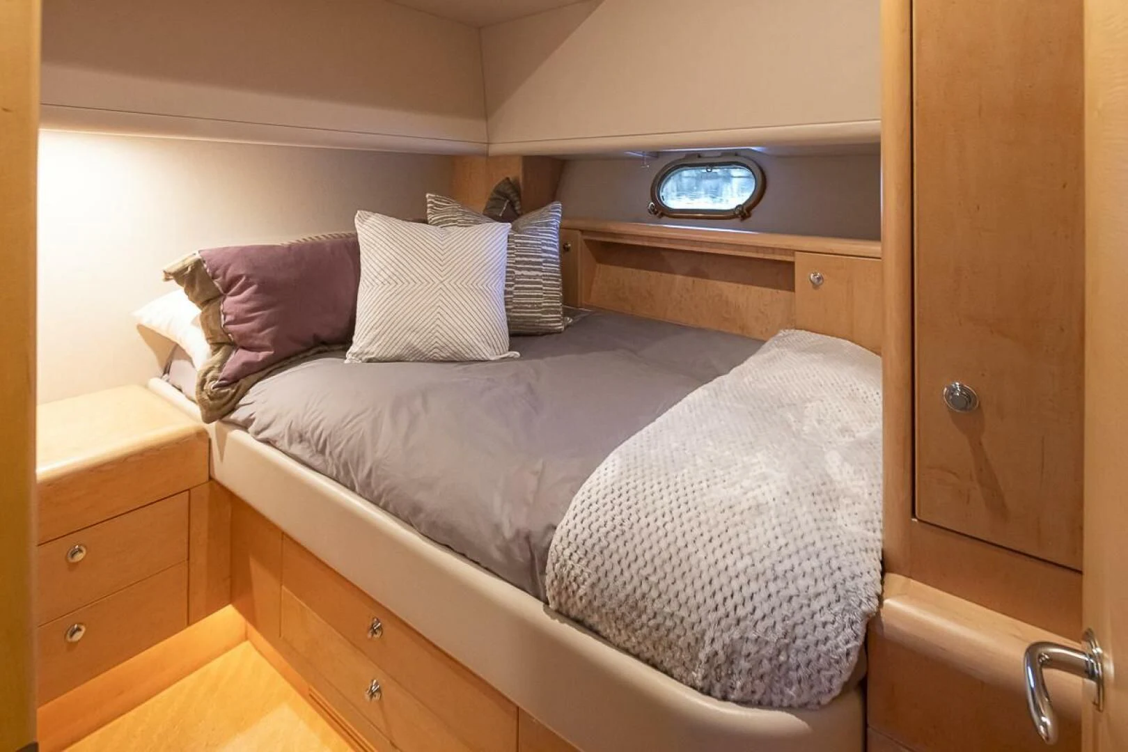 a bed with pillows aboard SEA SPUR Yacht for Sale