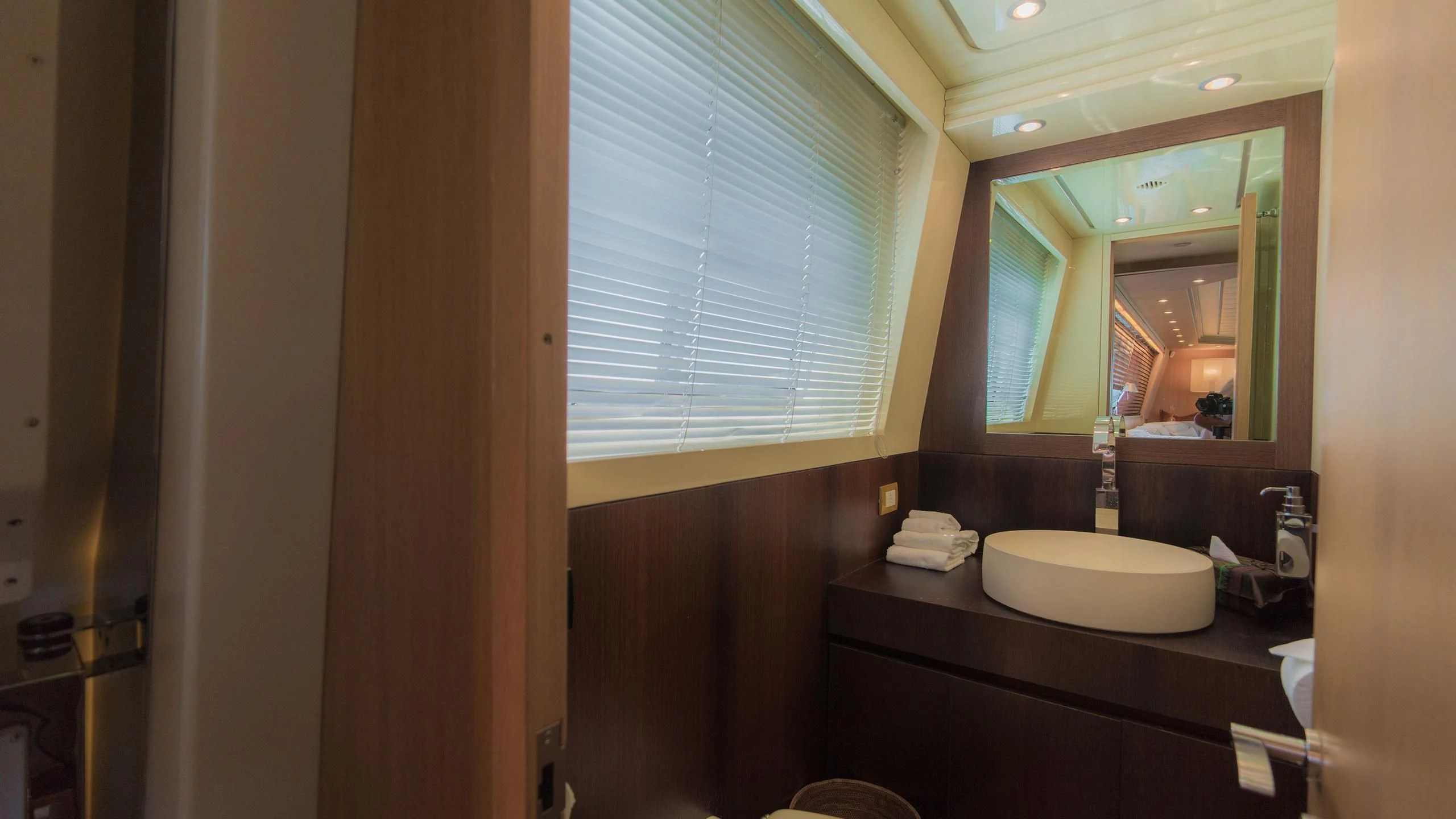 a bathroom with a sink and a mirror aboard AVELINE Yacht for Sale