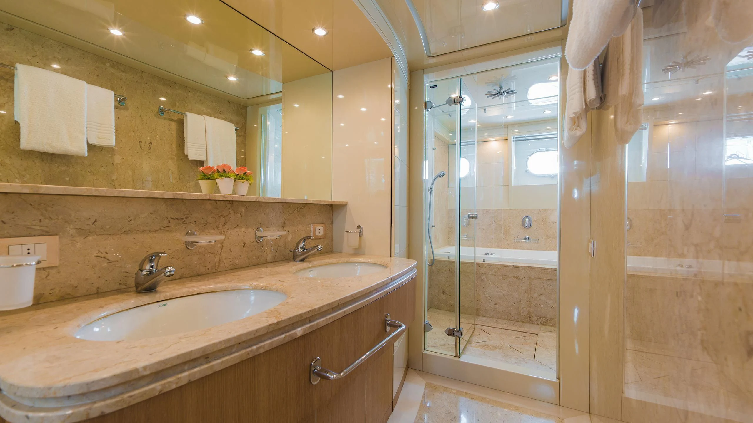 a bathroom with a glass shower aboard AVELINE Yacht for Sale
