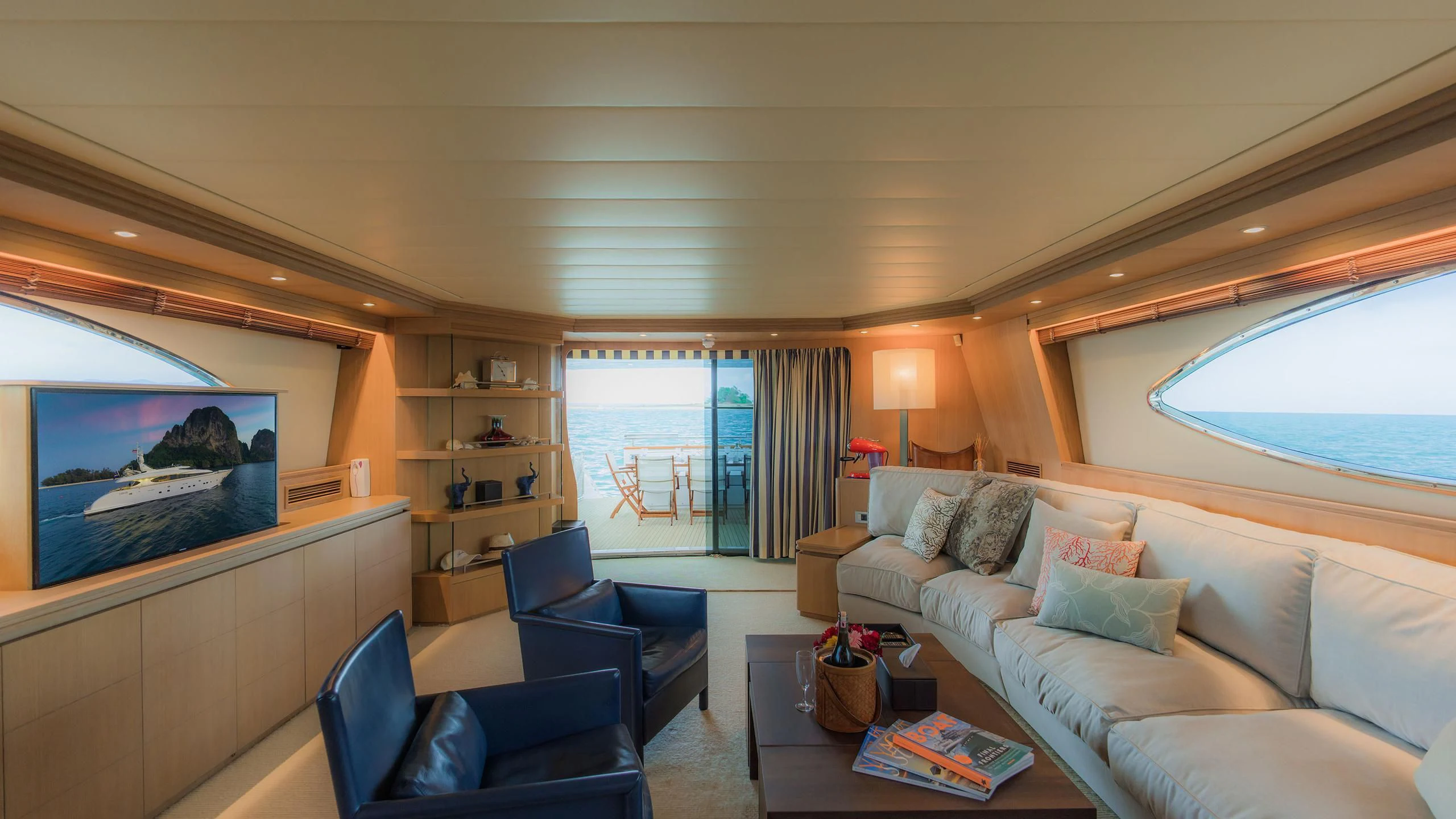 a living room with a large television aboard AVELINE Yacht for Sale