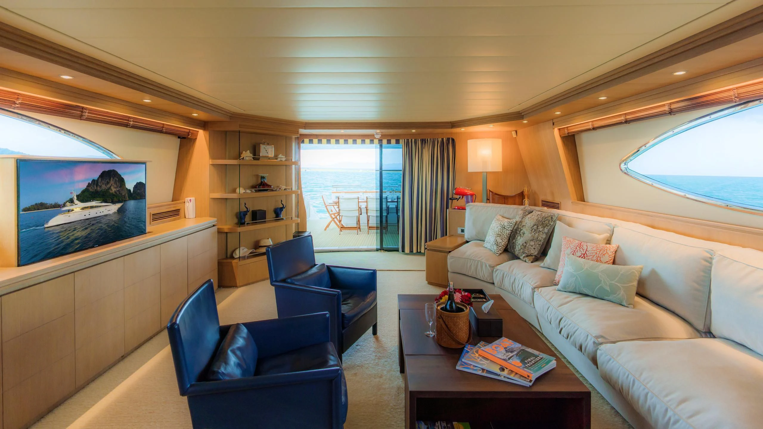 a living room with a couch and a television aboard AVELINE Yacht for Sale
