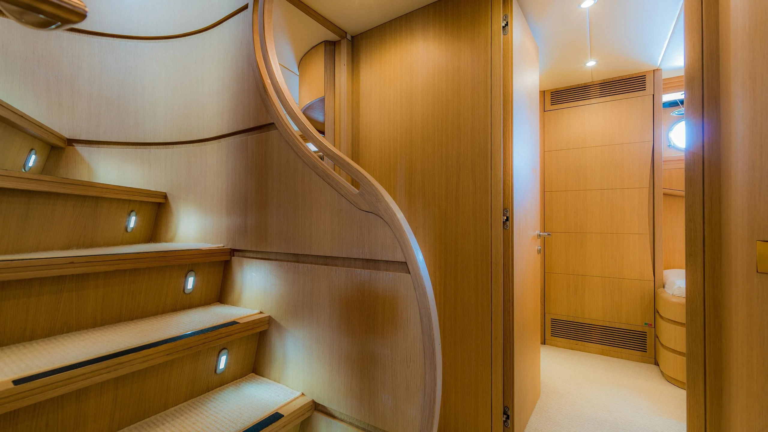 a bathroom with a wood door aboard AVELINE Yacht for Sale