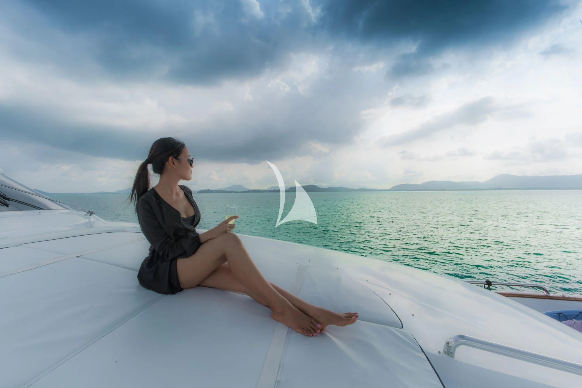 a woman sitting on a boat aboard AVELINE Yacht for Sale