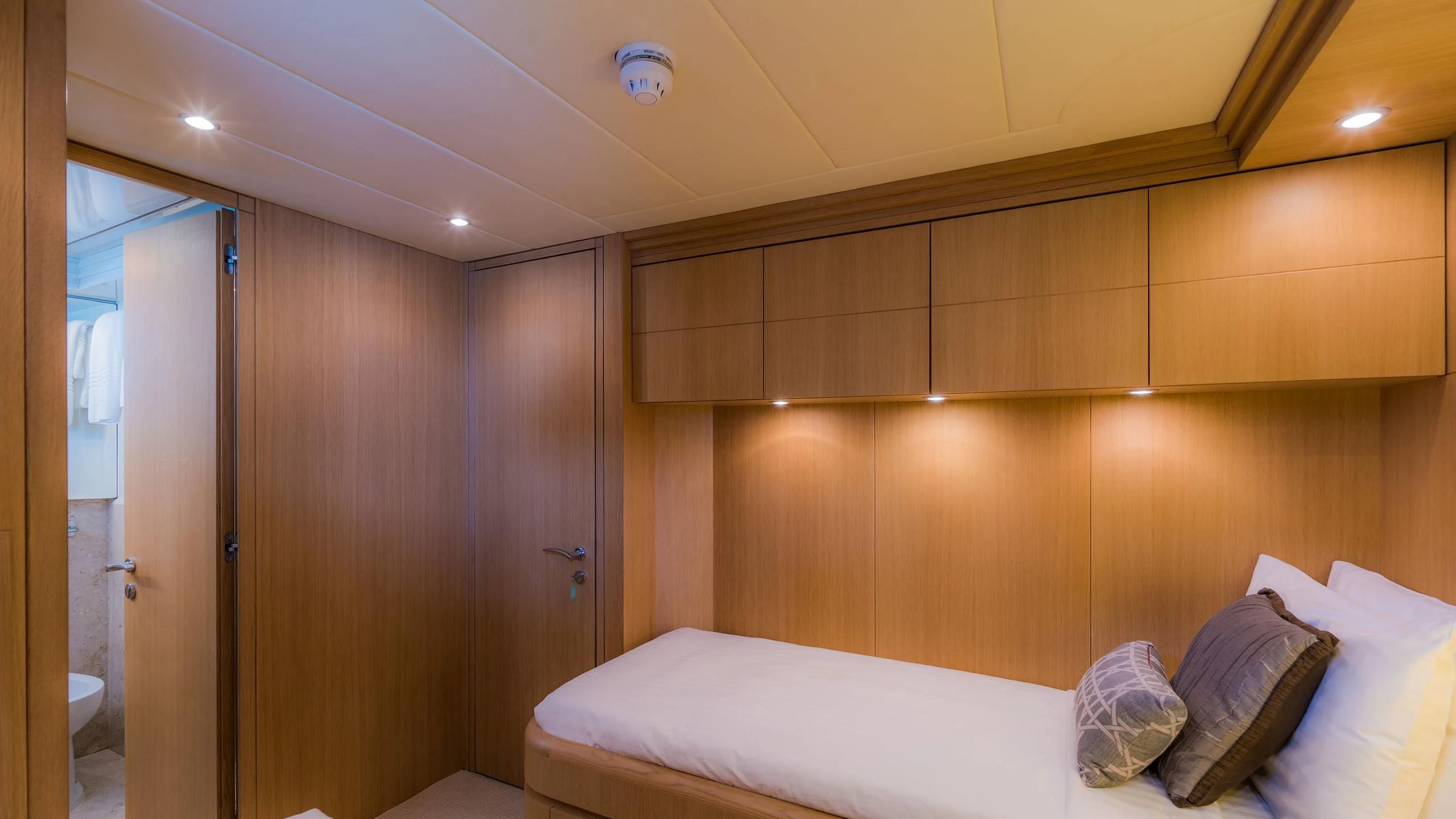 a room with a bed and a closet aboard AVELINE Yacht for Sale