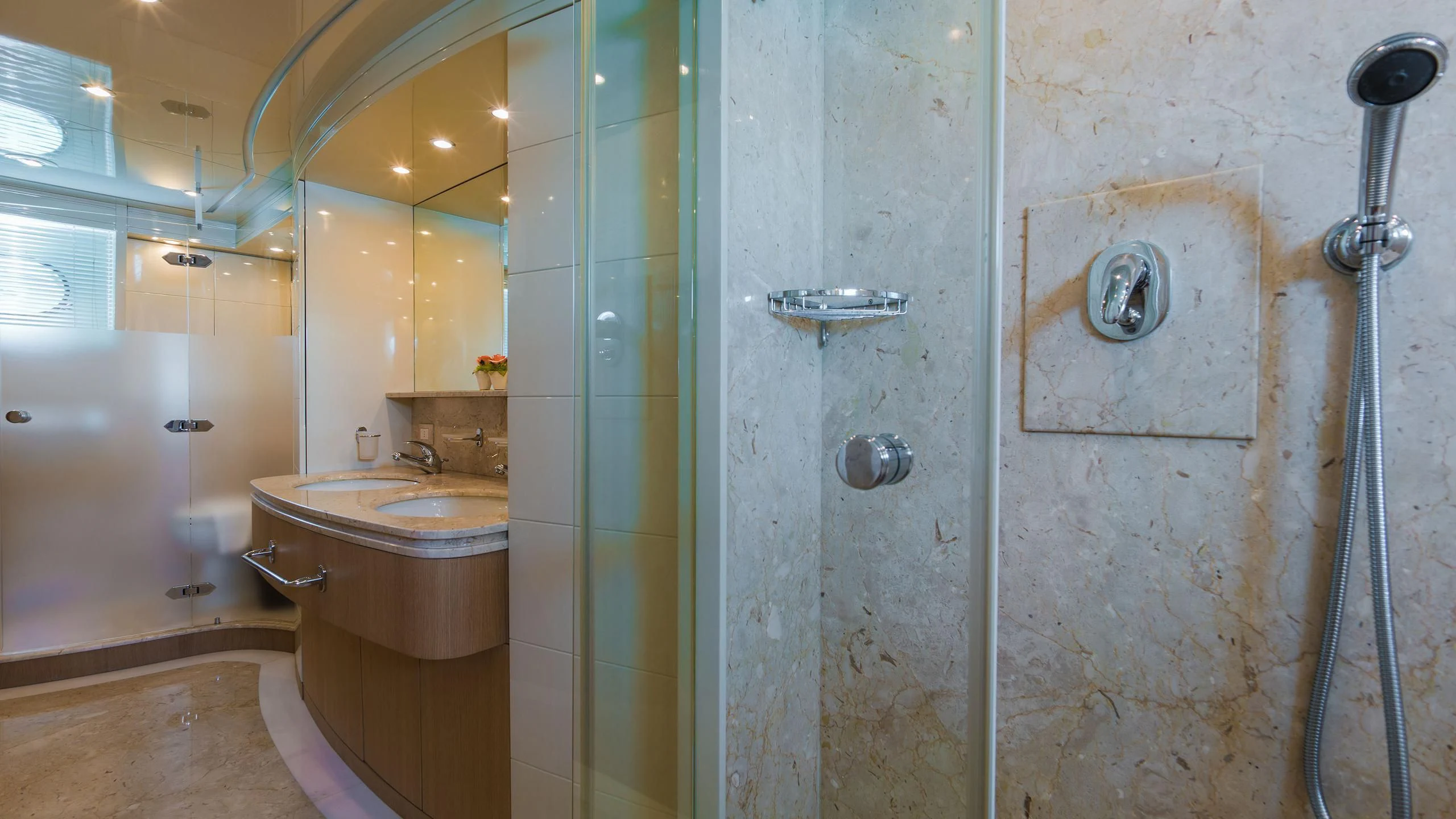 a bathroom with a sink and shower aboard AVELINE Yacht for Sale