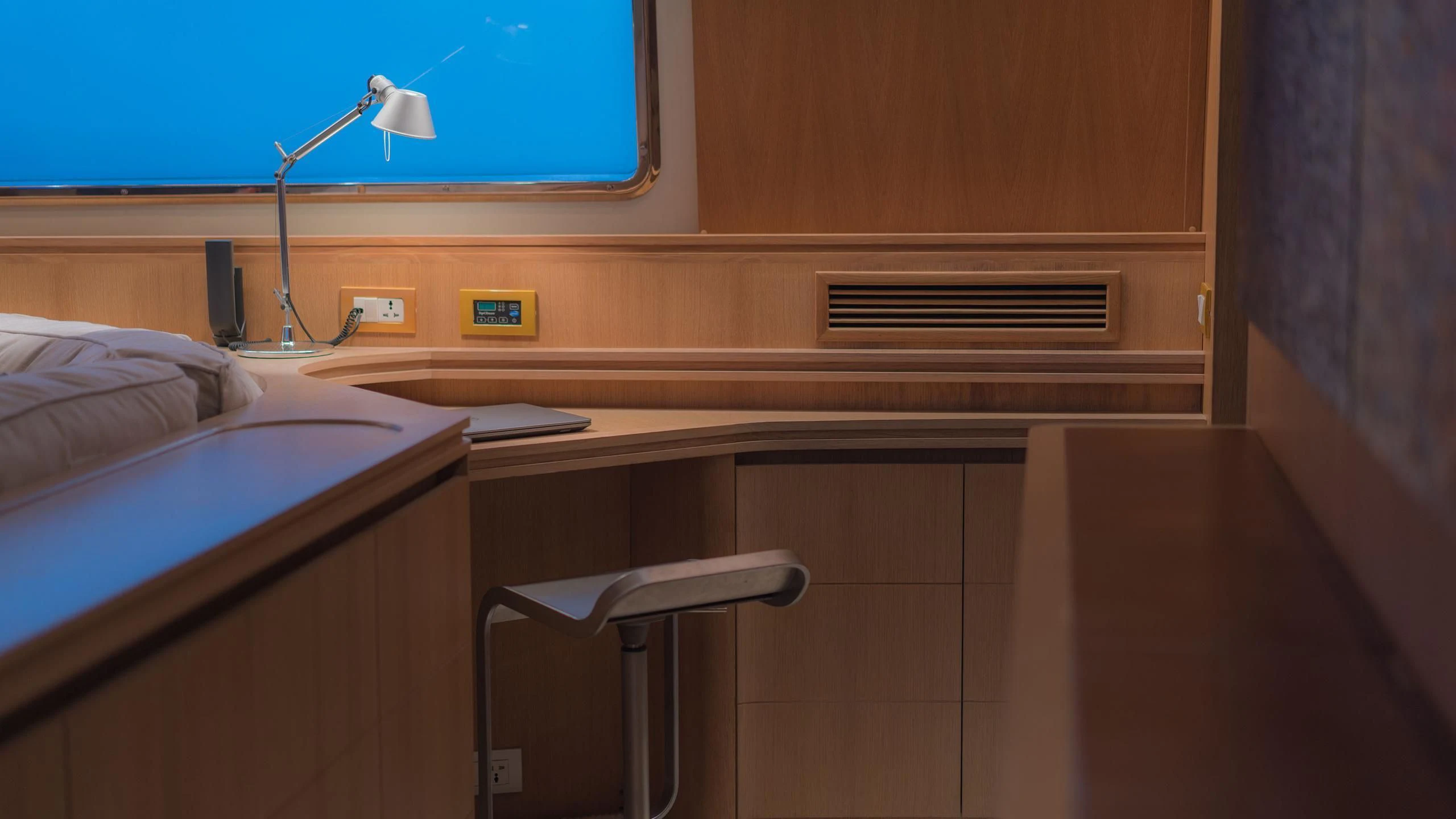 a bed and a desk in a room aboard AVELINE Yacht for Sale