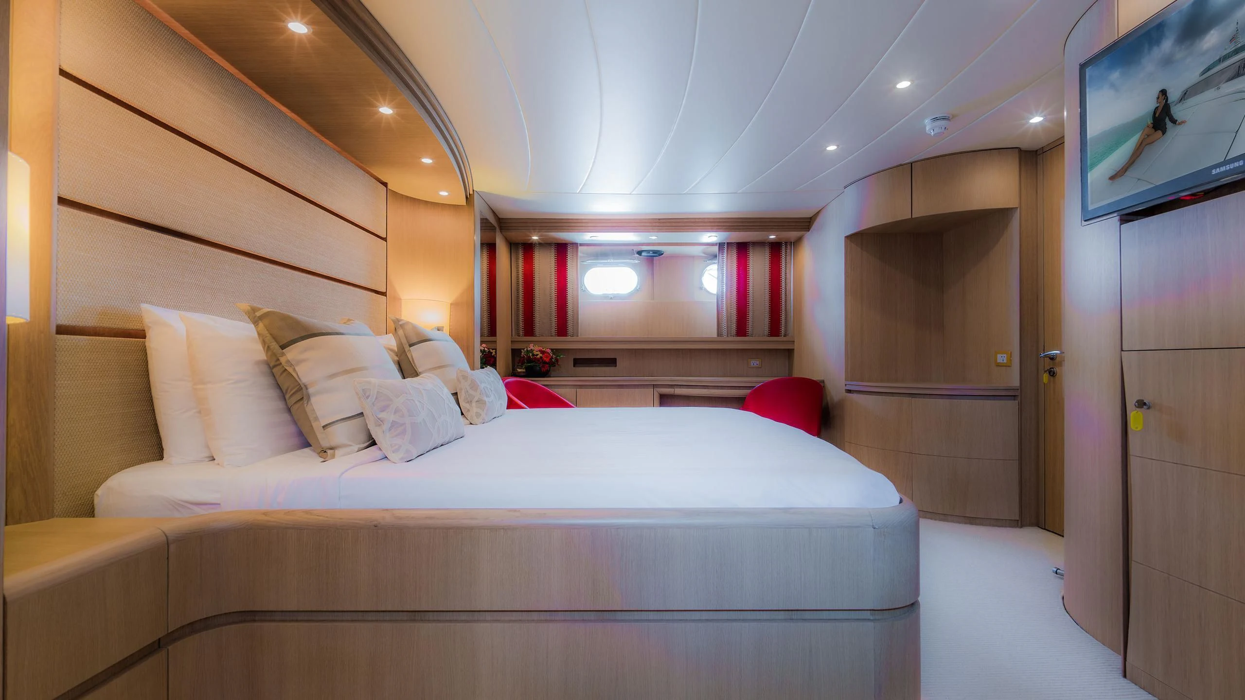 a room with a bed and a television aboard AVELINE Yacht for Sale