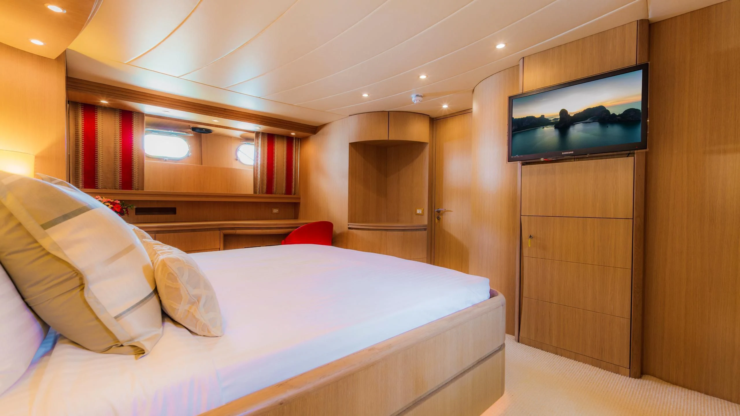 a room with a bed and a television aboard AVELINE Yacht for Sale