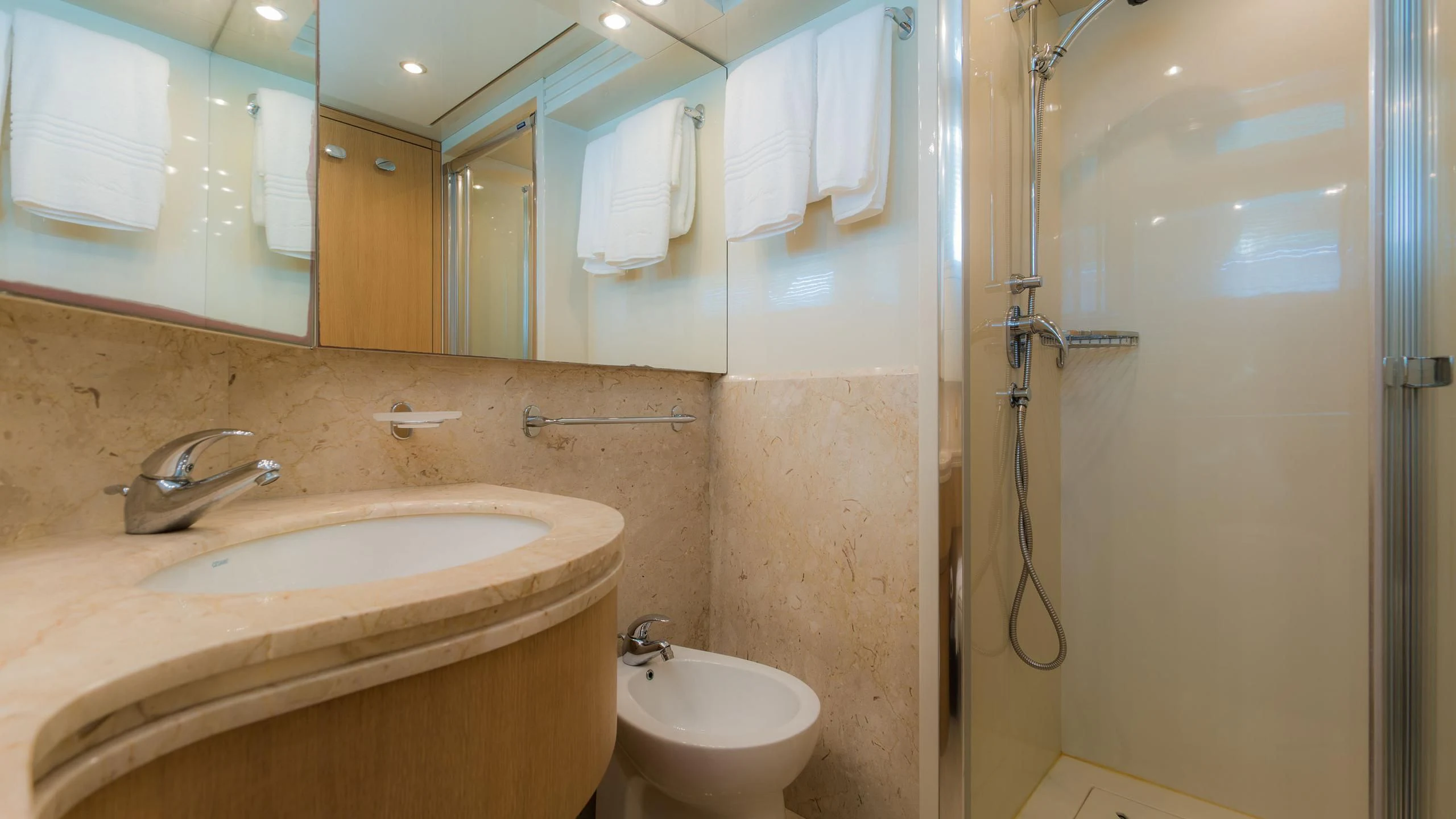 a bathroom with a sink and a mirror aboard AVELINE Yacht for Sale