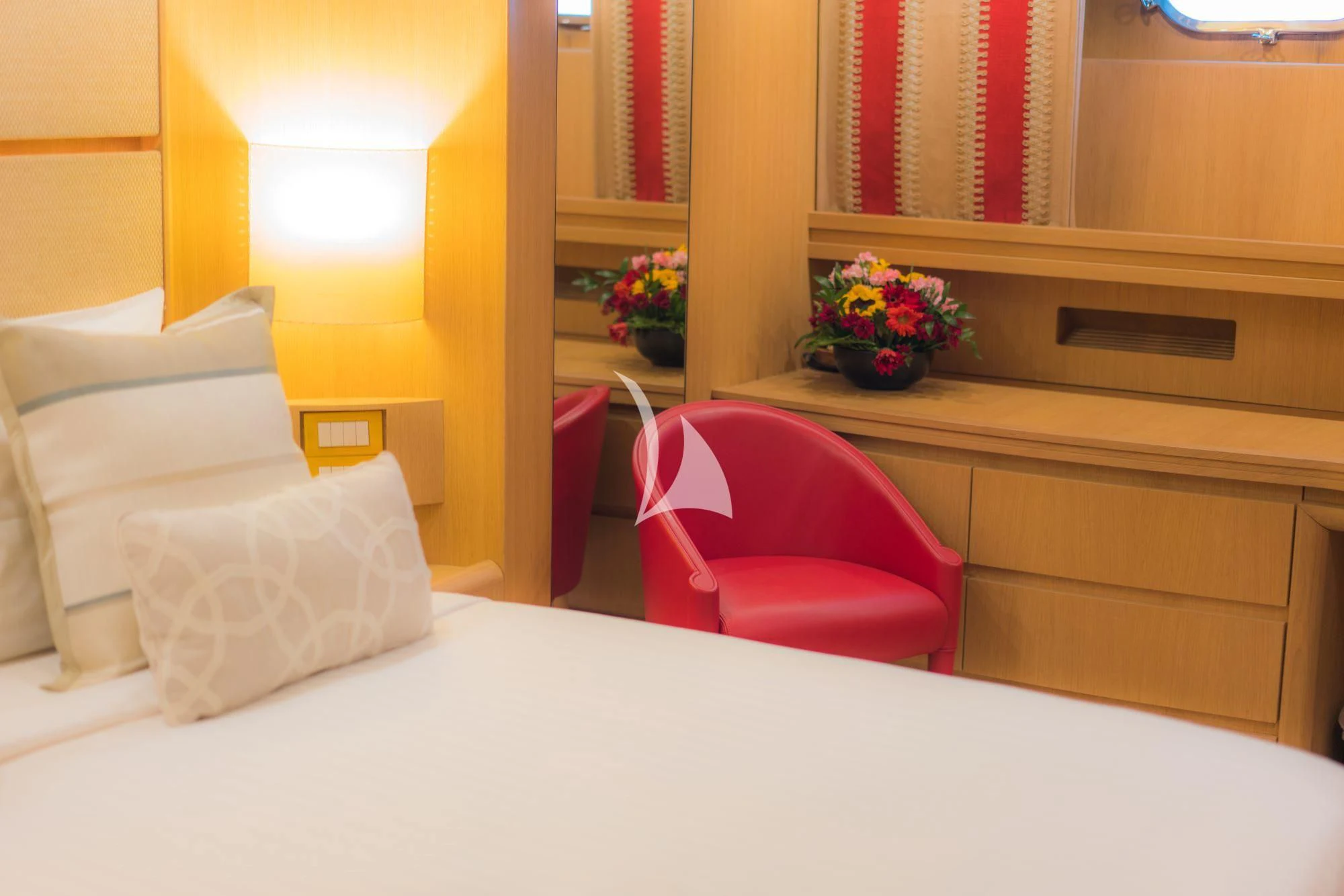 a room with a bed and a chair aboard AVELINE Yacht for Sale
