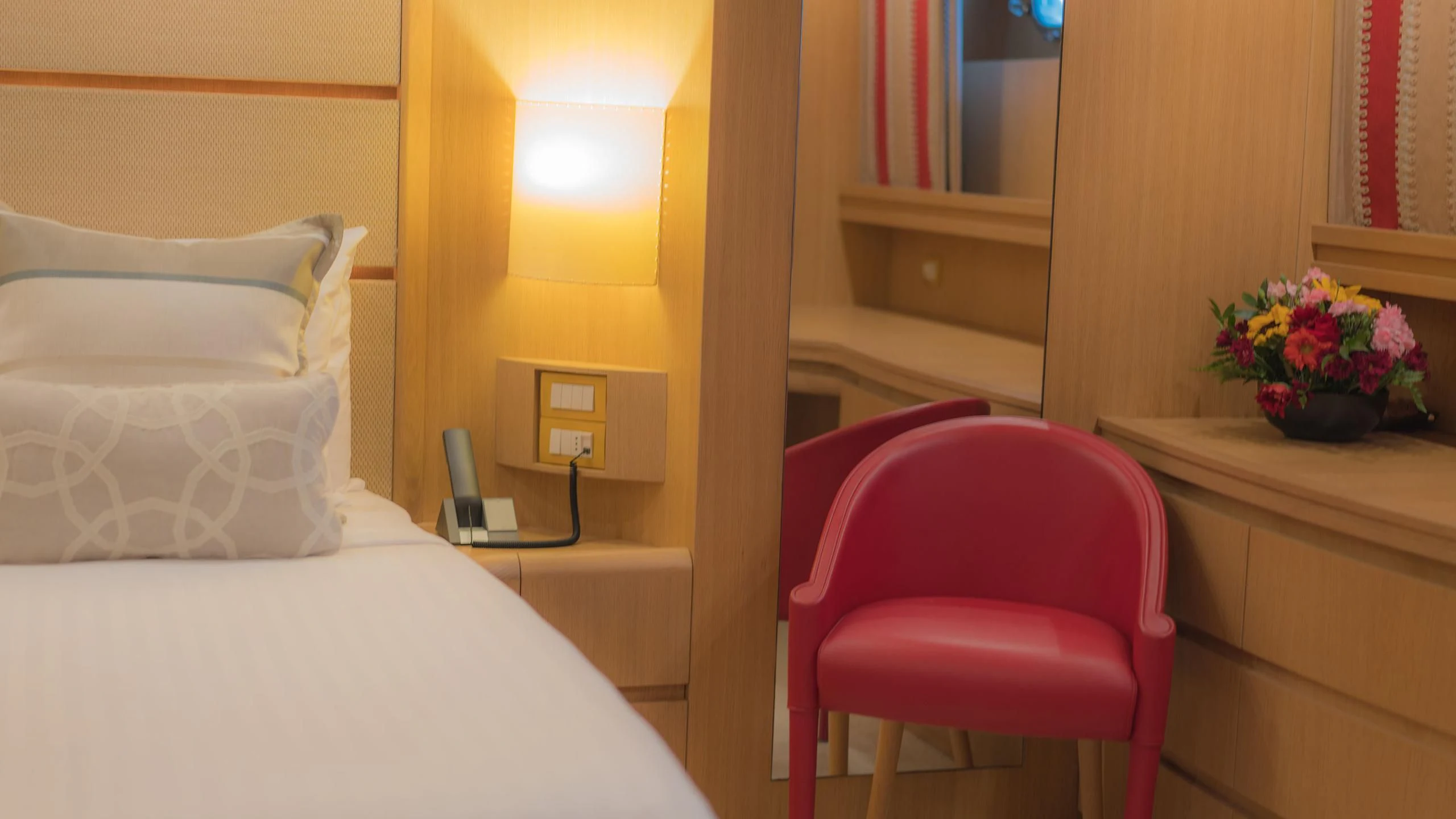 a room with a bed and a desk aboard AVELINE Yacht for Sale
