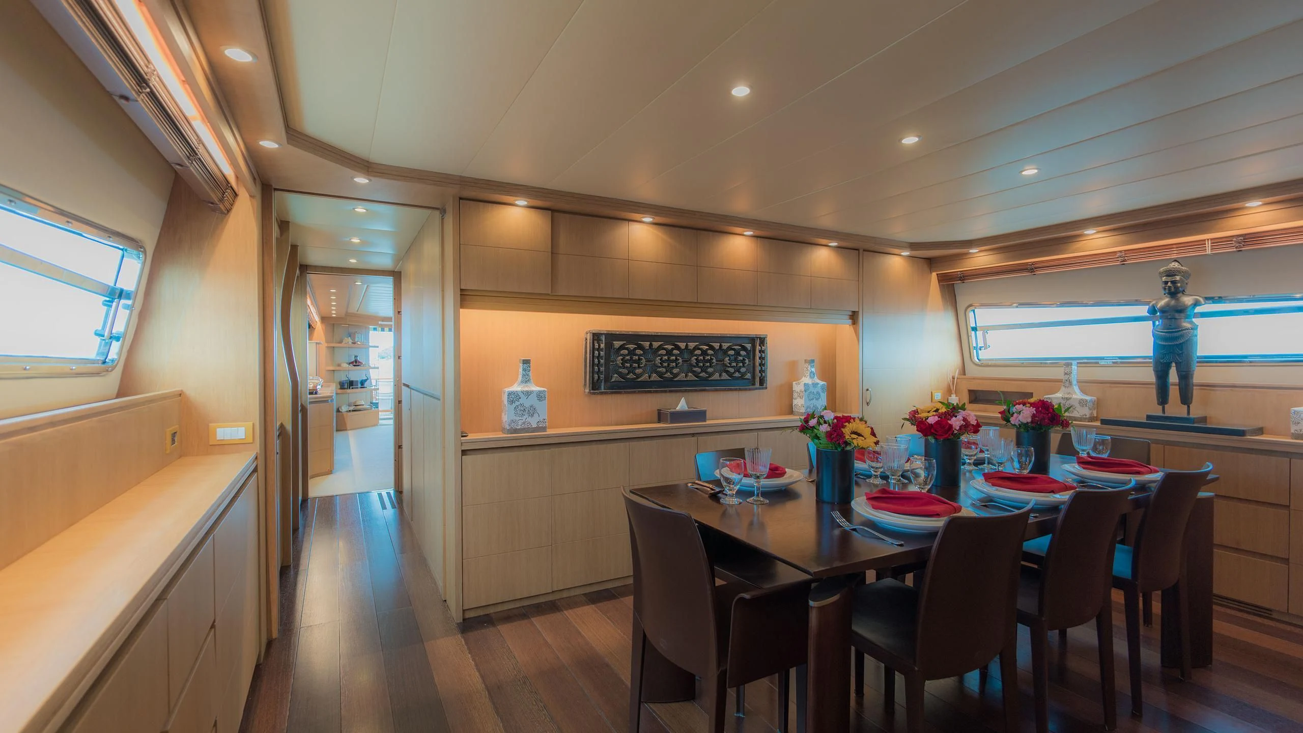 a large kitchen with a table and chairs aboard AVELINE Yacht for Sale