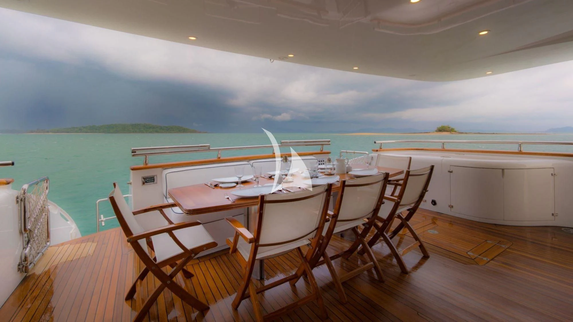 a dining table on a deck aboard AVELINE Yacht for Sale
