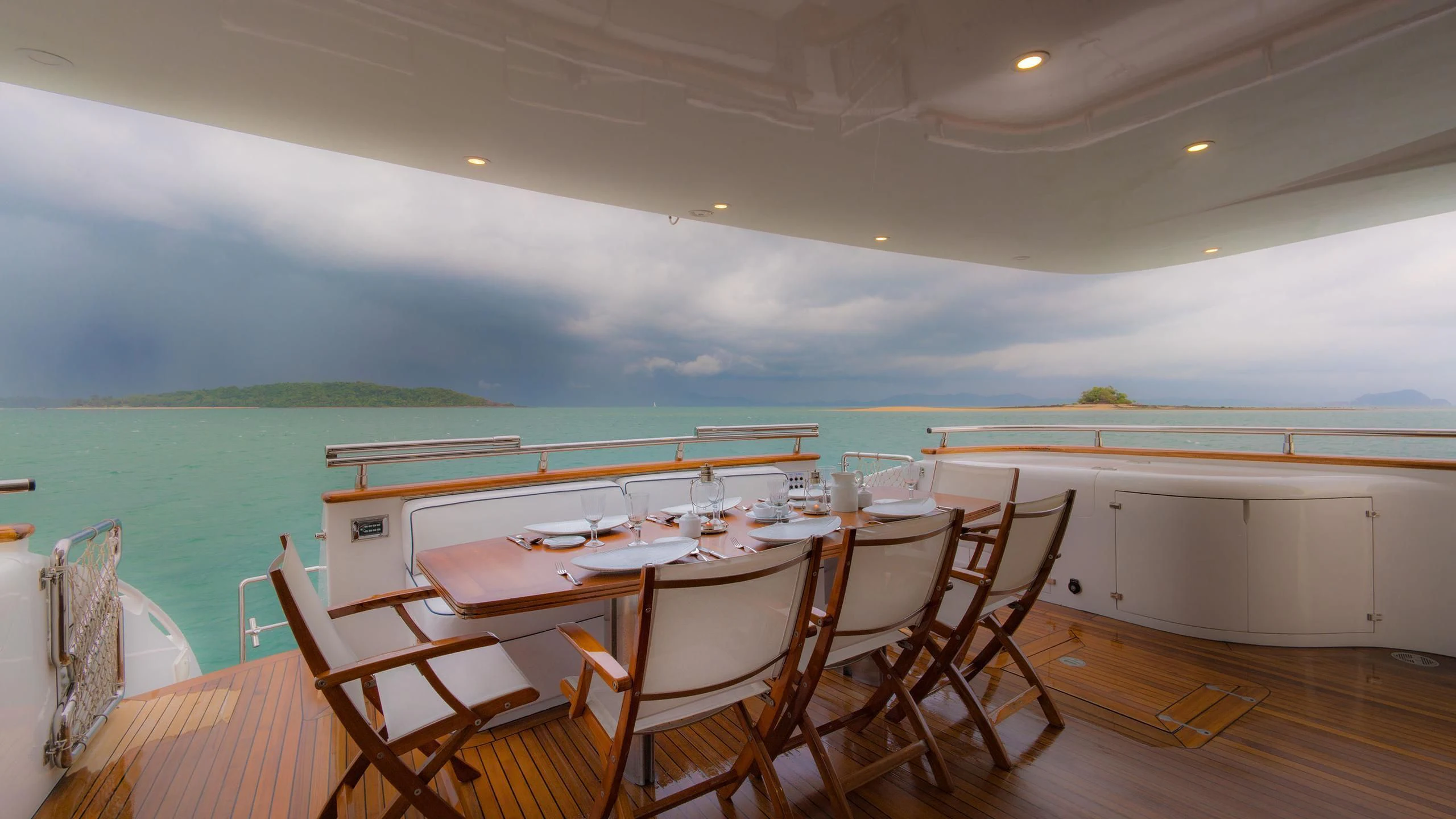 a dining table set for a dinner party aboard AVELINE Yacht for Sale