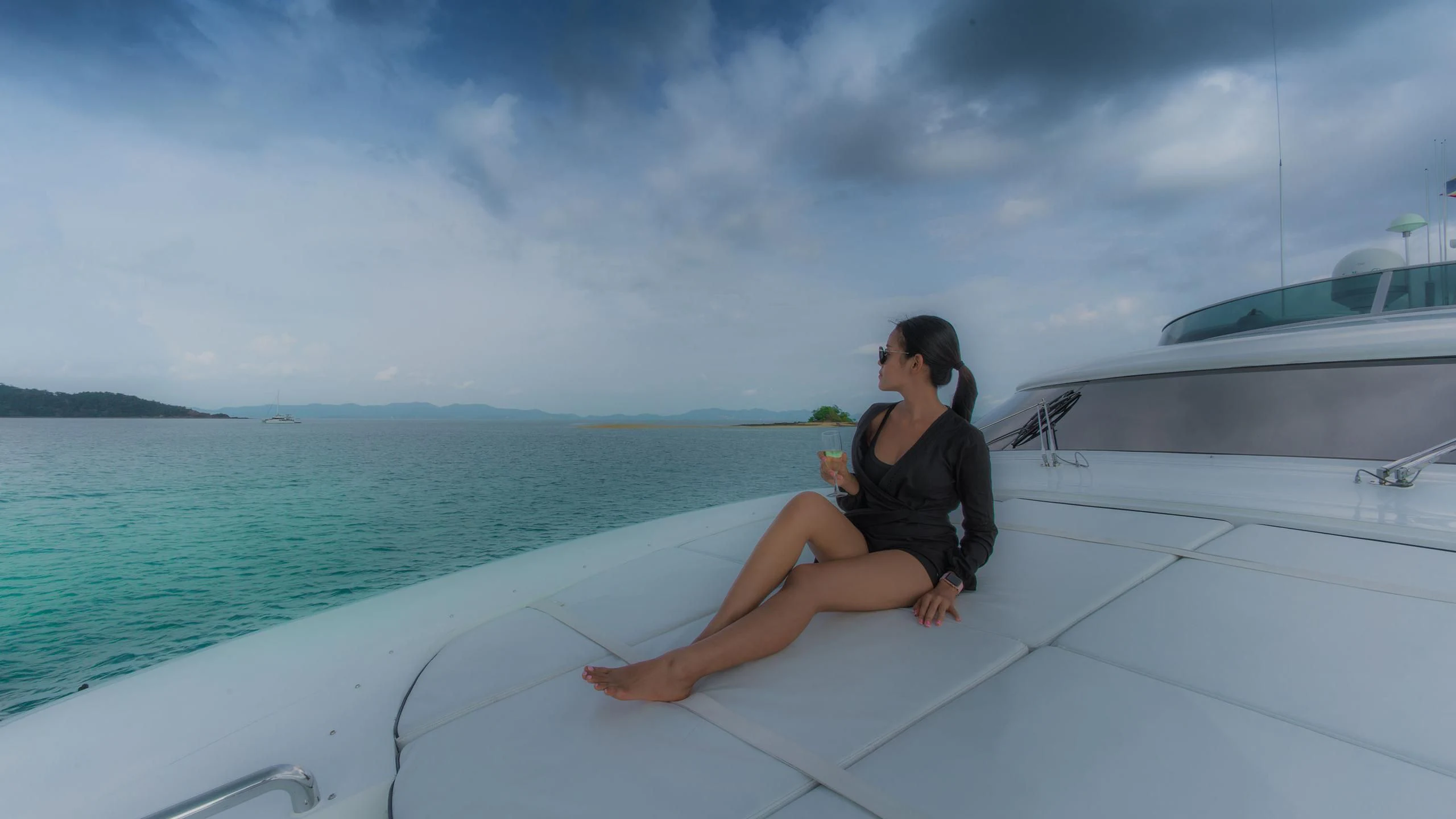 a man sitting on a boat aboard AVELINE Yacht for Sale