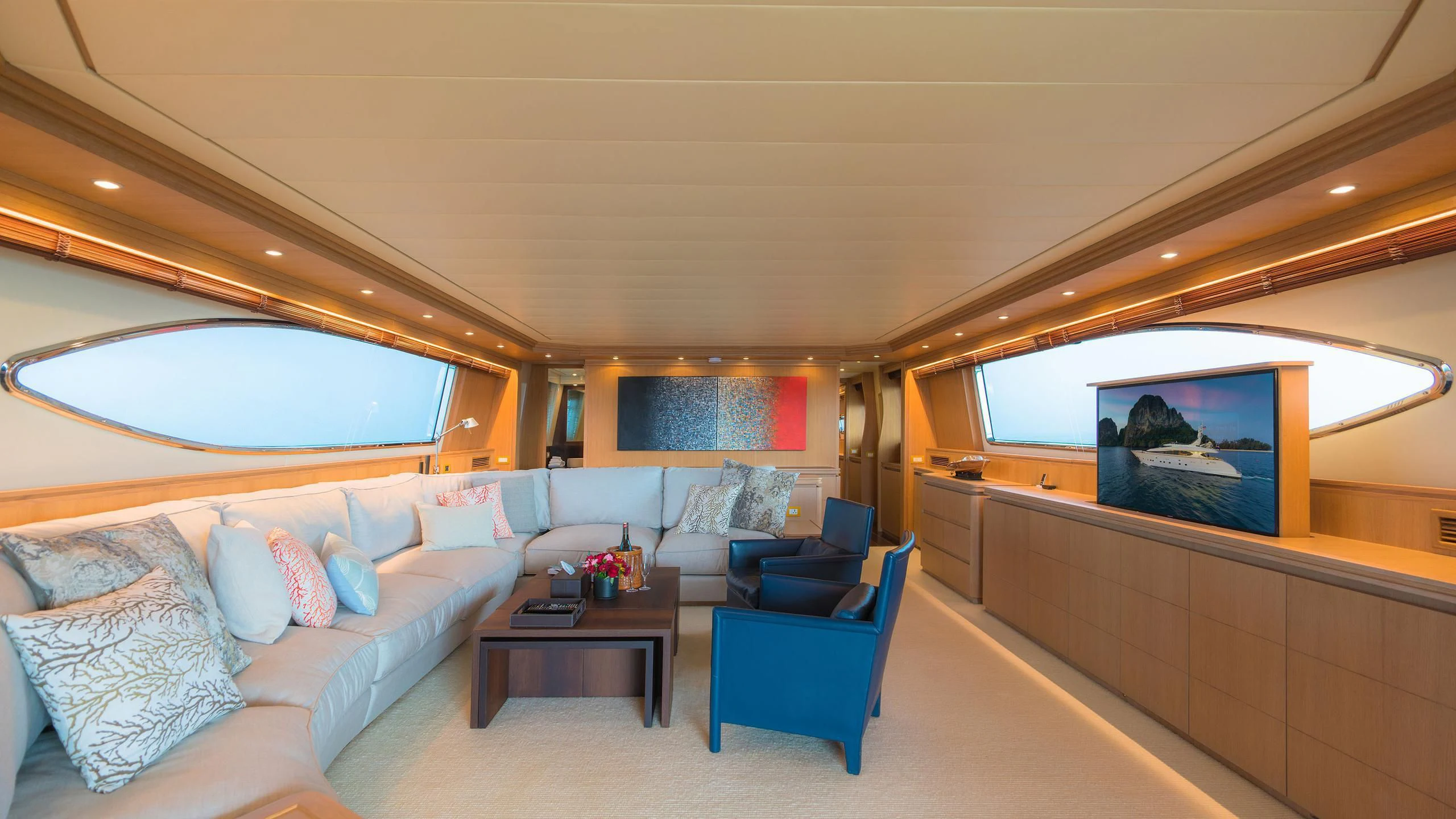 a room with a couch and a television aboard AVELINE Yacht for Sale