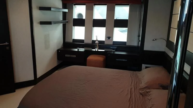 a person lying on a bed aboard MR LEO Yacht for Sale