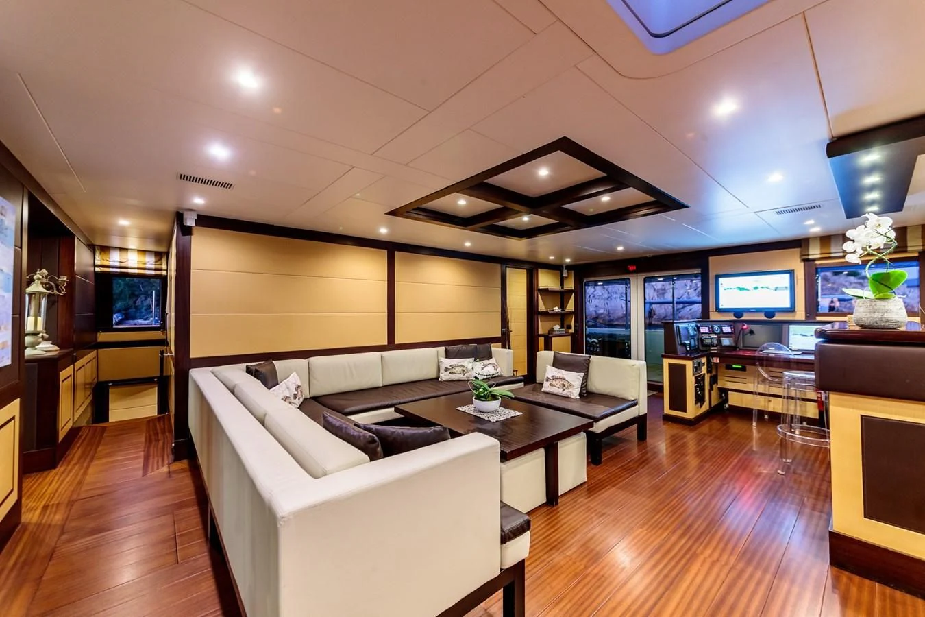 a living room with a large screen aboard ALLURES Yacht for Charter
