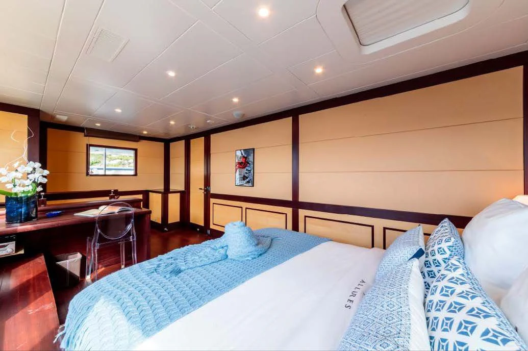 a bed in a room aboard ALLURES Yacht for Charter