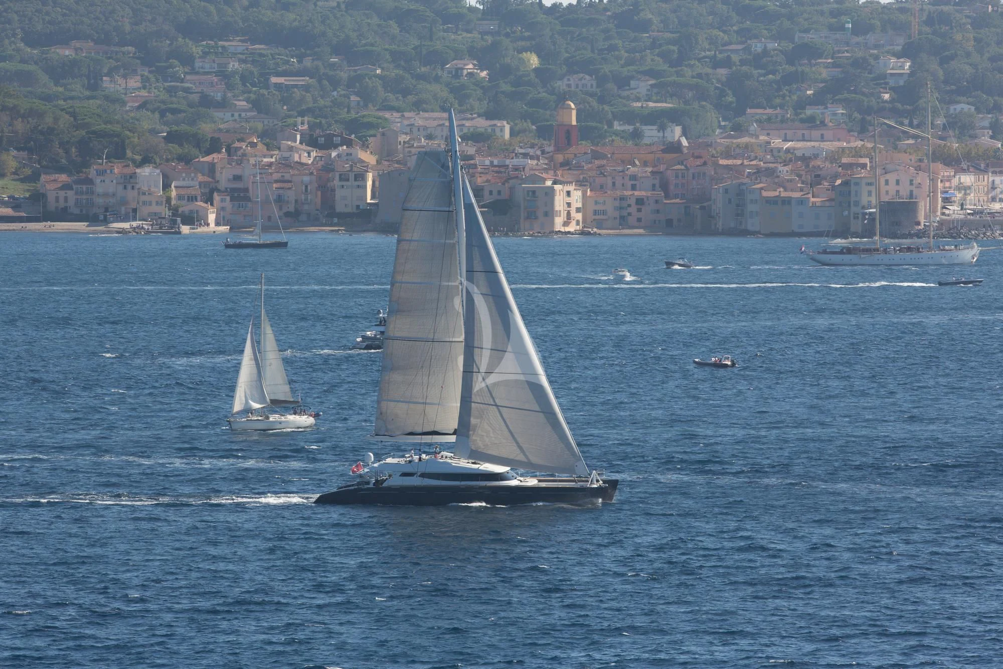 a group of boats on the water aboard ALLURES Yacht for Charter
