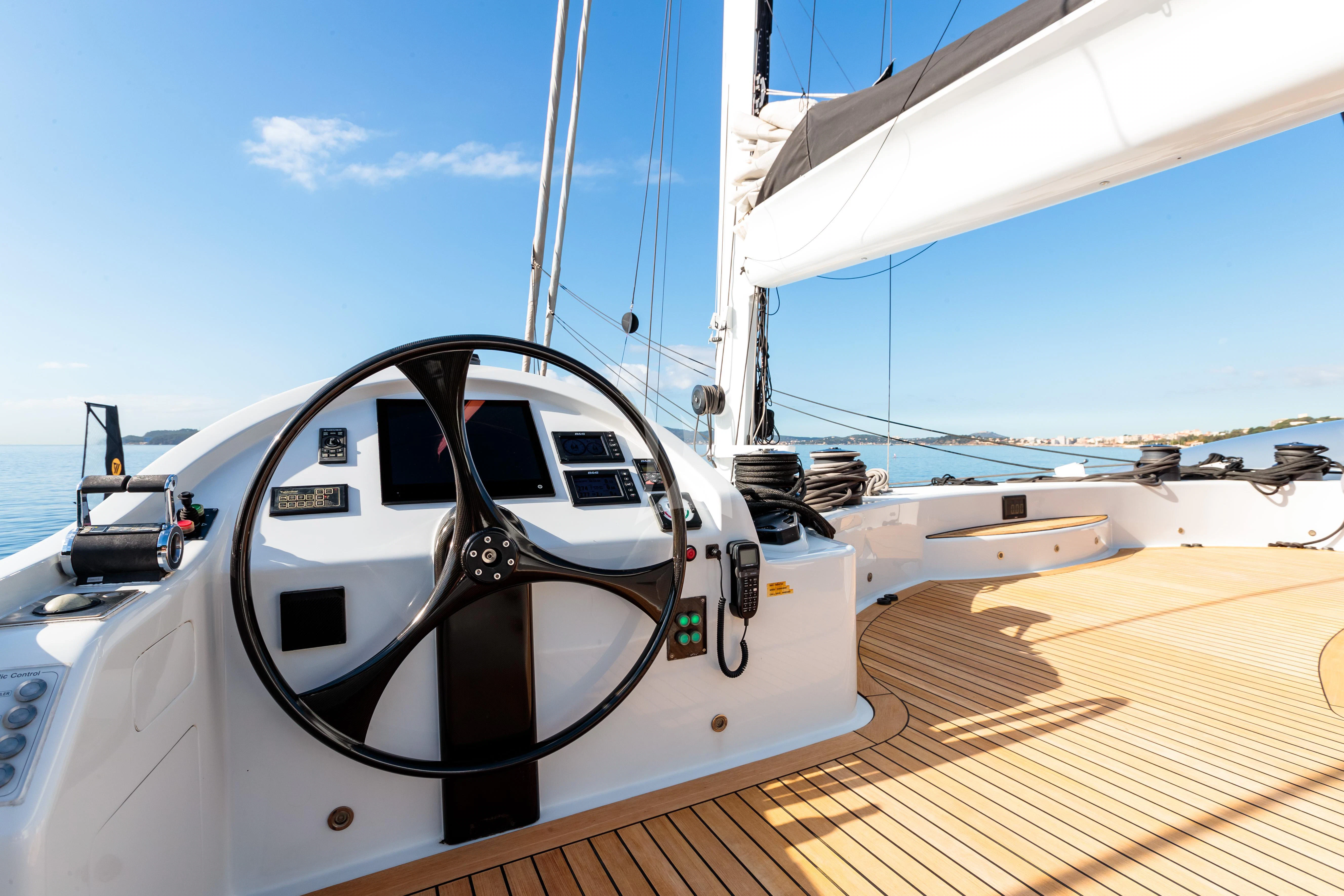 a white boat on a dock aboard ALLURES Yacht for Charter