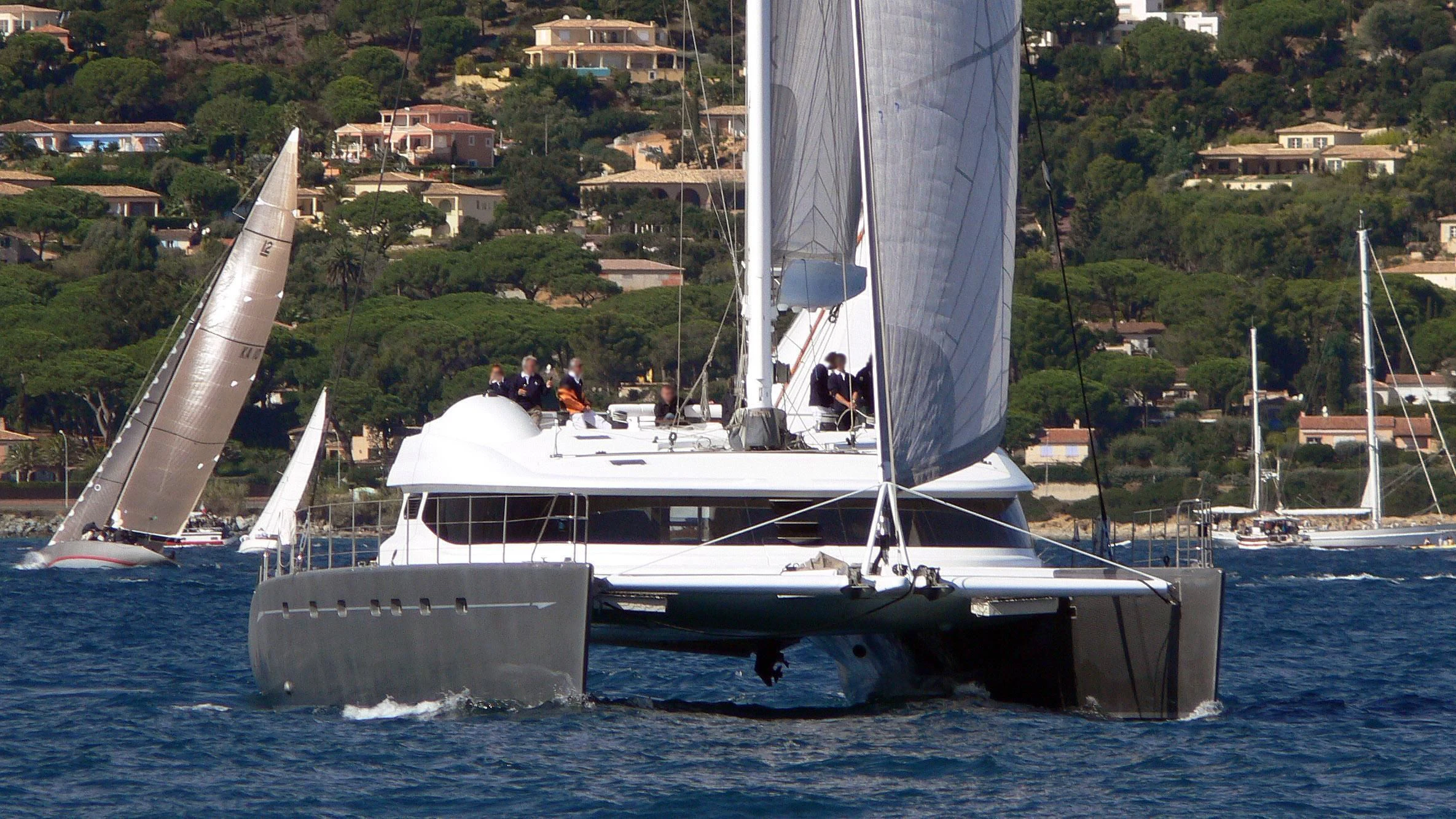 a boat sailing on the water aboard ALLURES Yacht for Charter