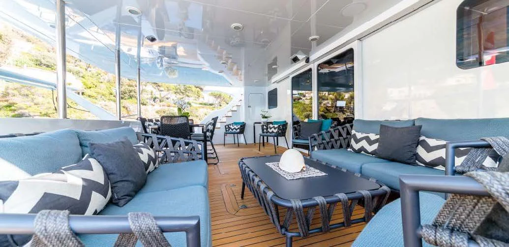 a living room with a large window aboard ALLURES Yacht for Charter