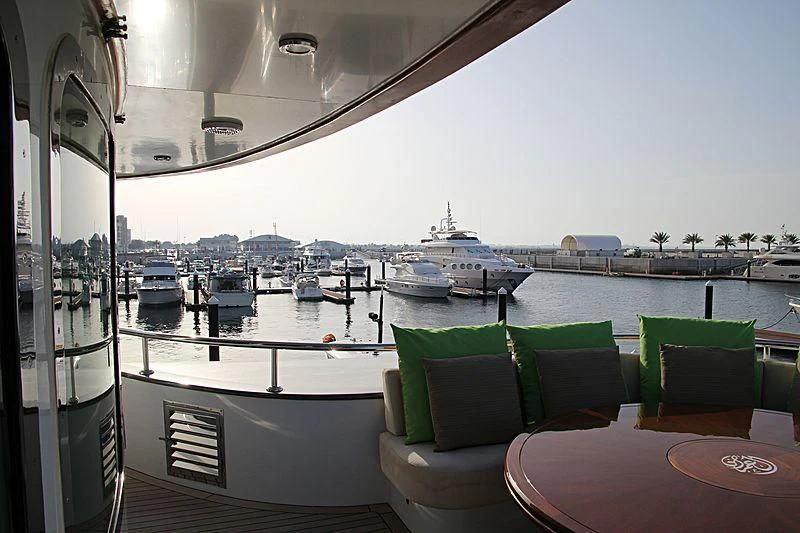 a boat is parked on the side of a large body of water aboard AMARA Yacht for Sale
