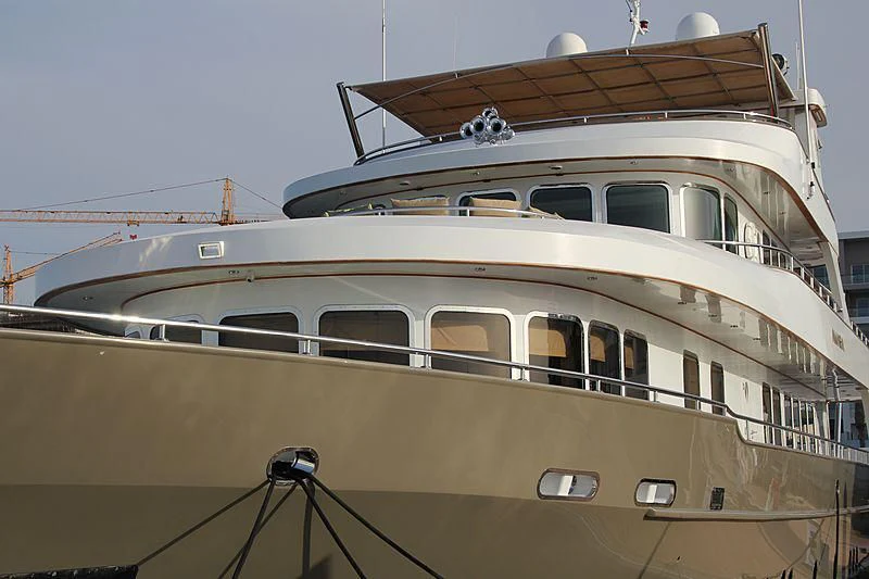 a large cruise ship docked aboard AMARA Yacht for Sale