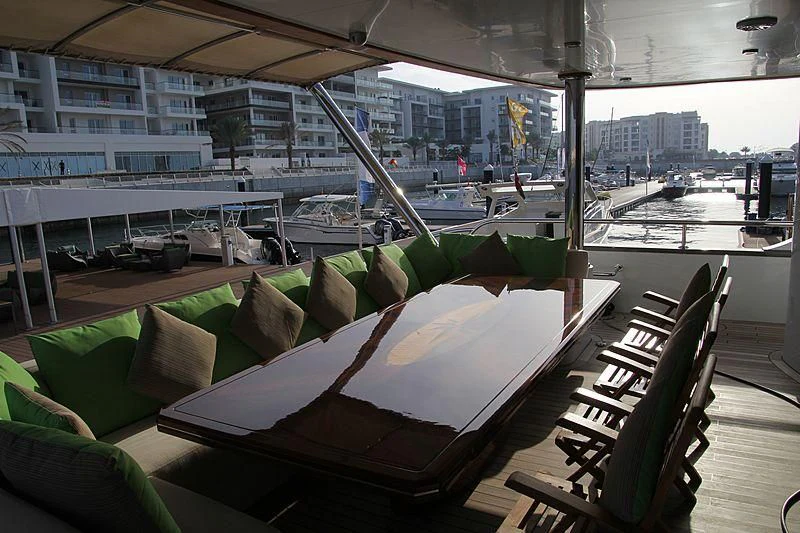 a room with a view of a city and a large window aboard AMARA Yacht for Sale