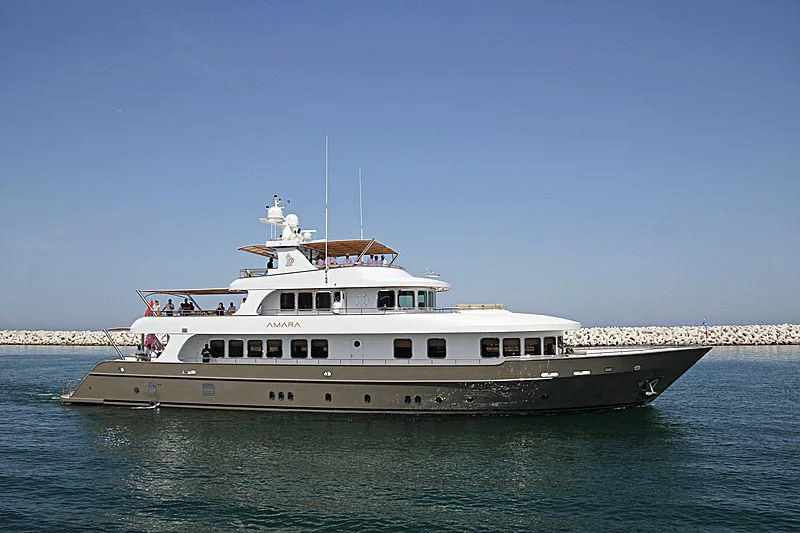 a large ship in the water aboard AMARA Yacht for Sale