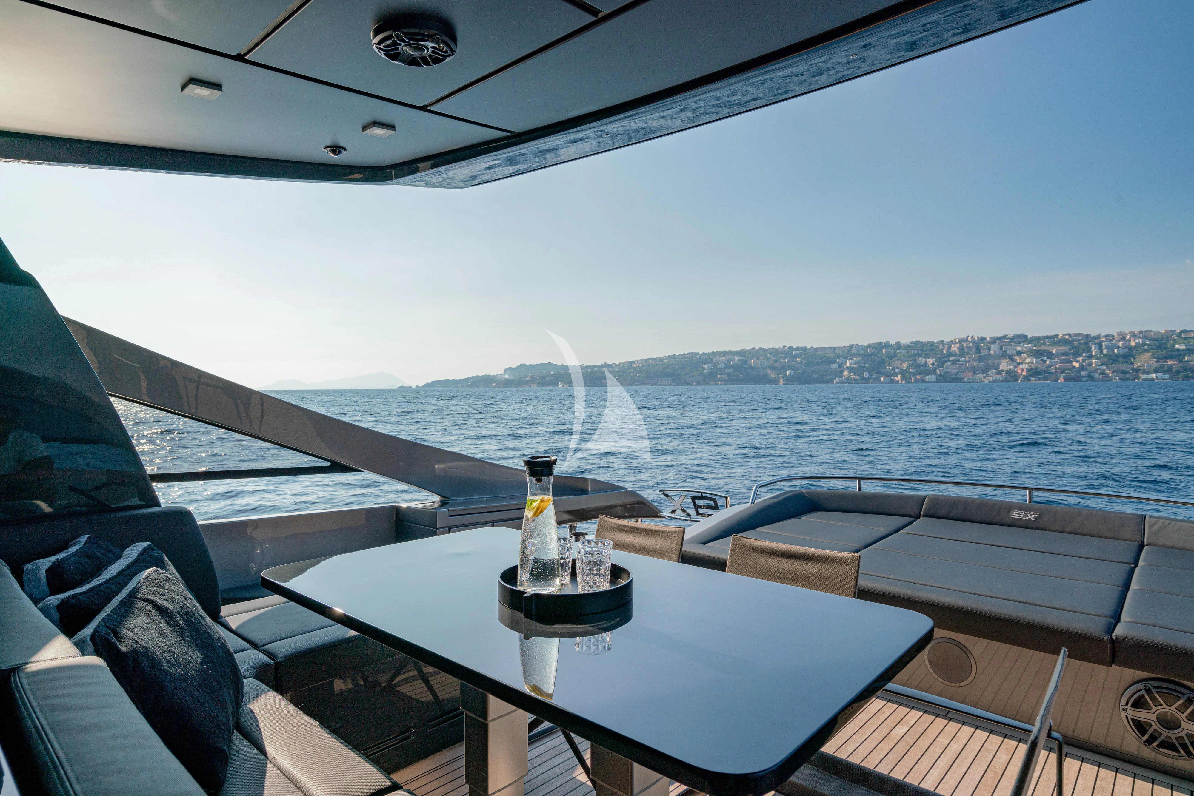 a boat with a table and a bottle on it aboard SOPHIA Yacht for Sale