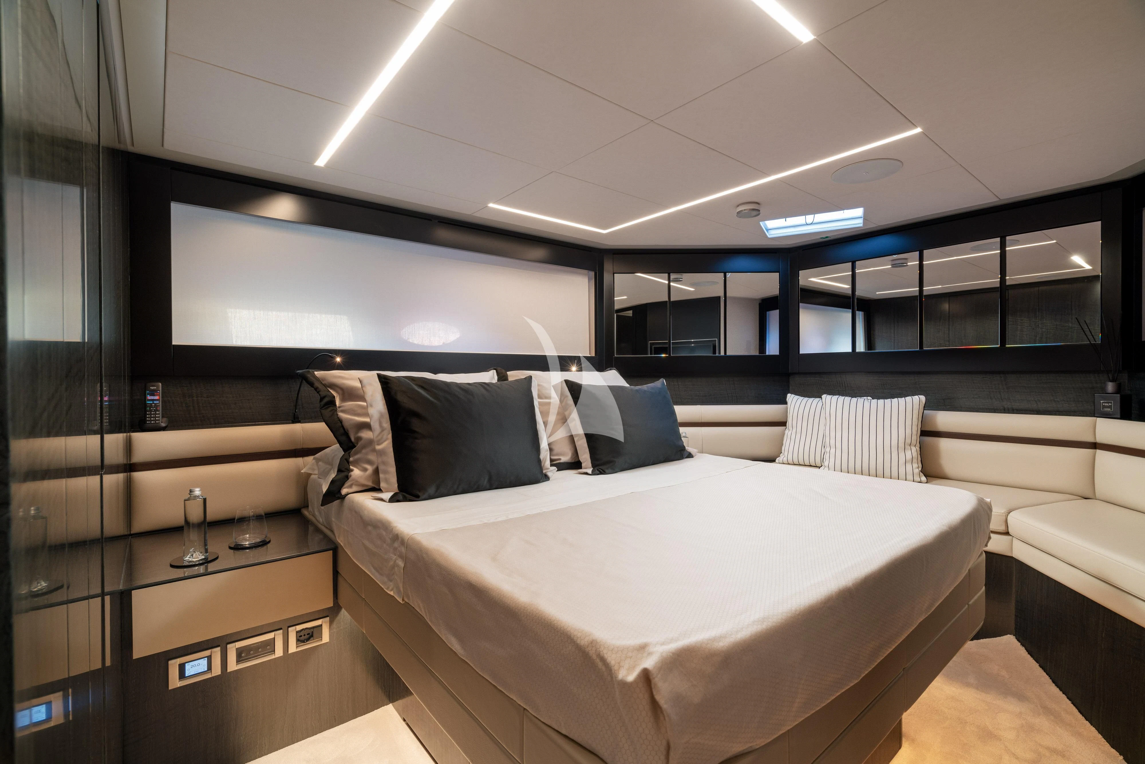a room with a bed and a large screen aboard SOPHIA Yacht for Sale