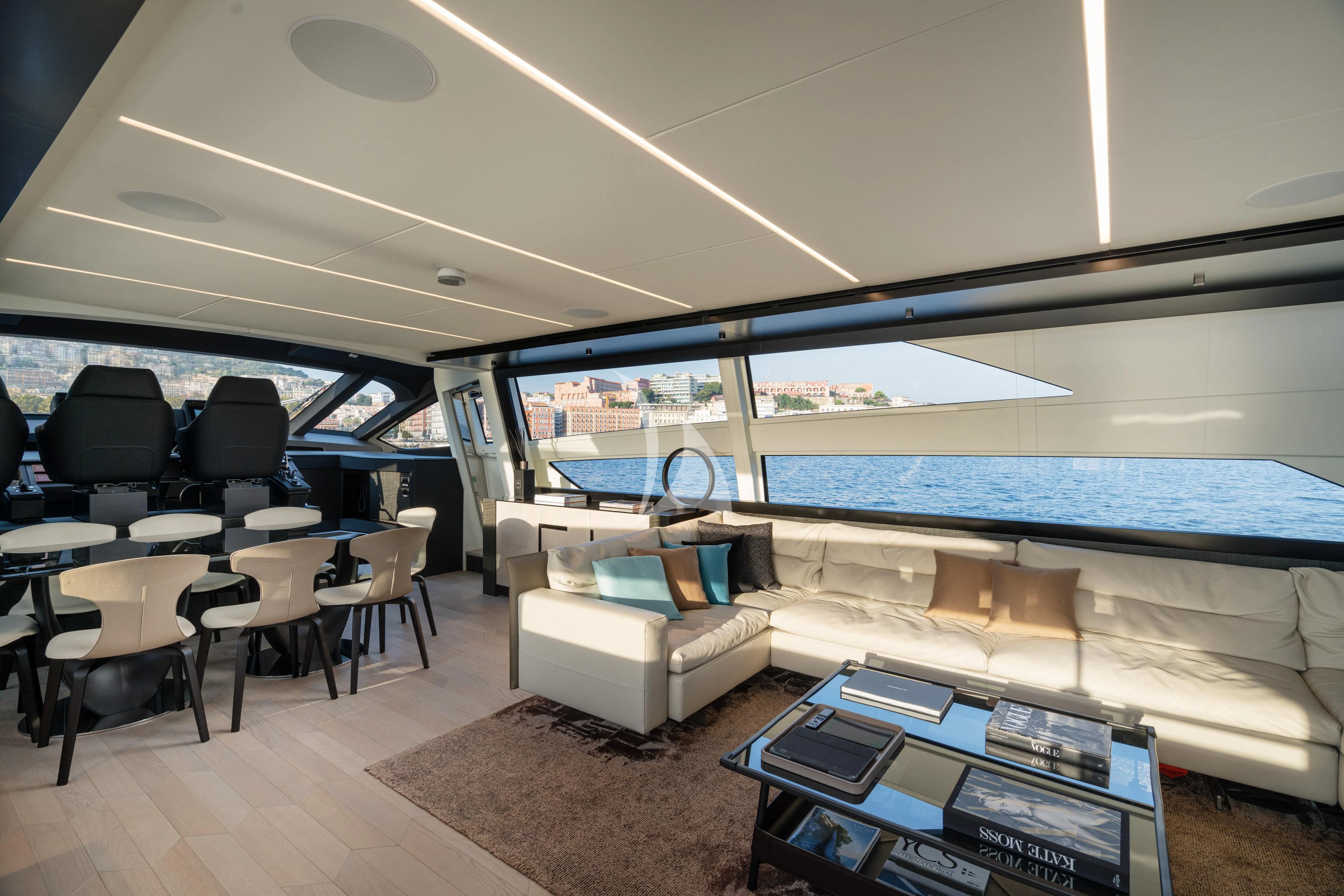 a room with a large window and a pool table and chairs aboard SOPHIA Yacht for Sale