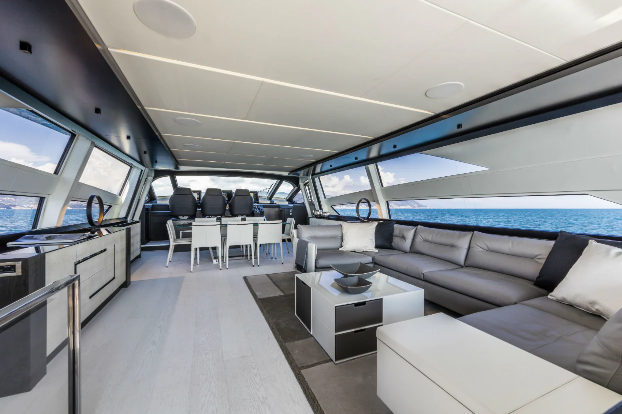 inside of a vehicle with a large window and a table and chairs aboard SOPHIA Yacht for Sale