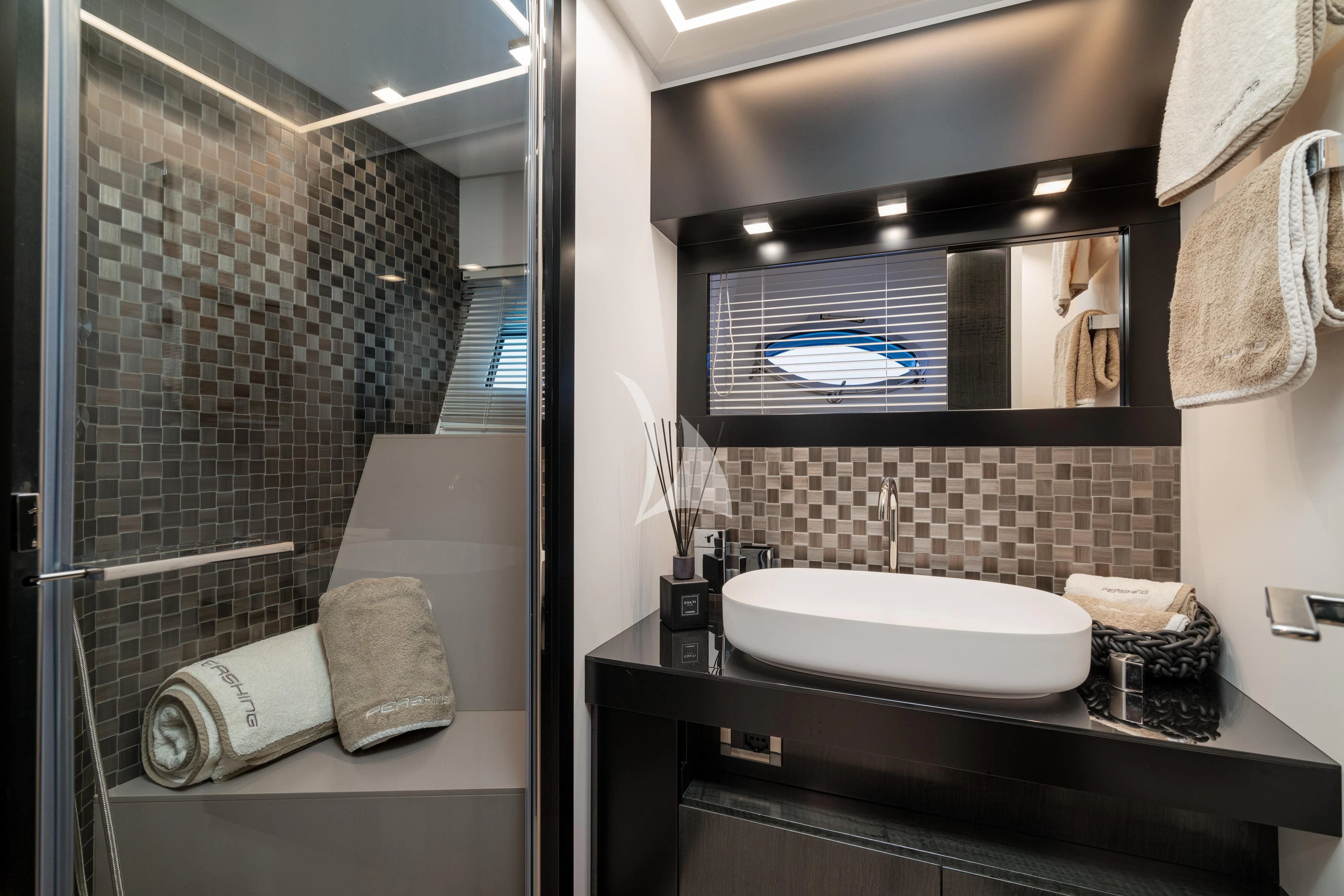 a bathroom with a large mirror aboard SOPHIA Yacht for Sale