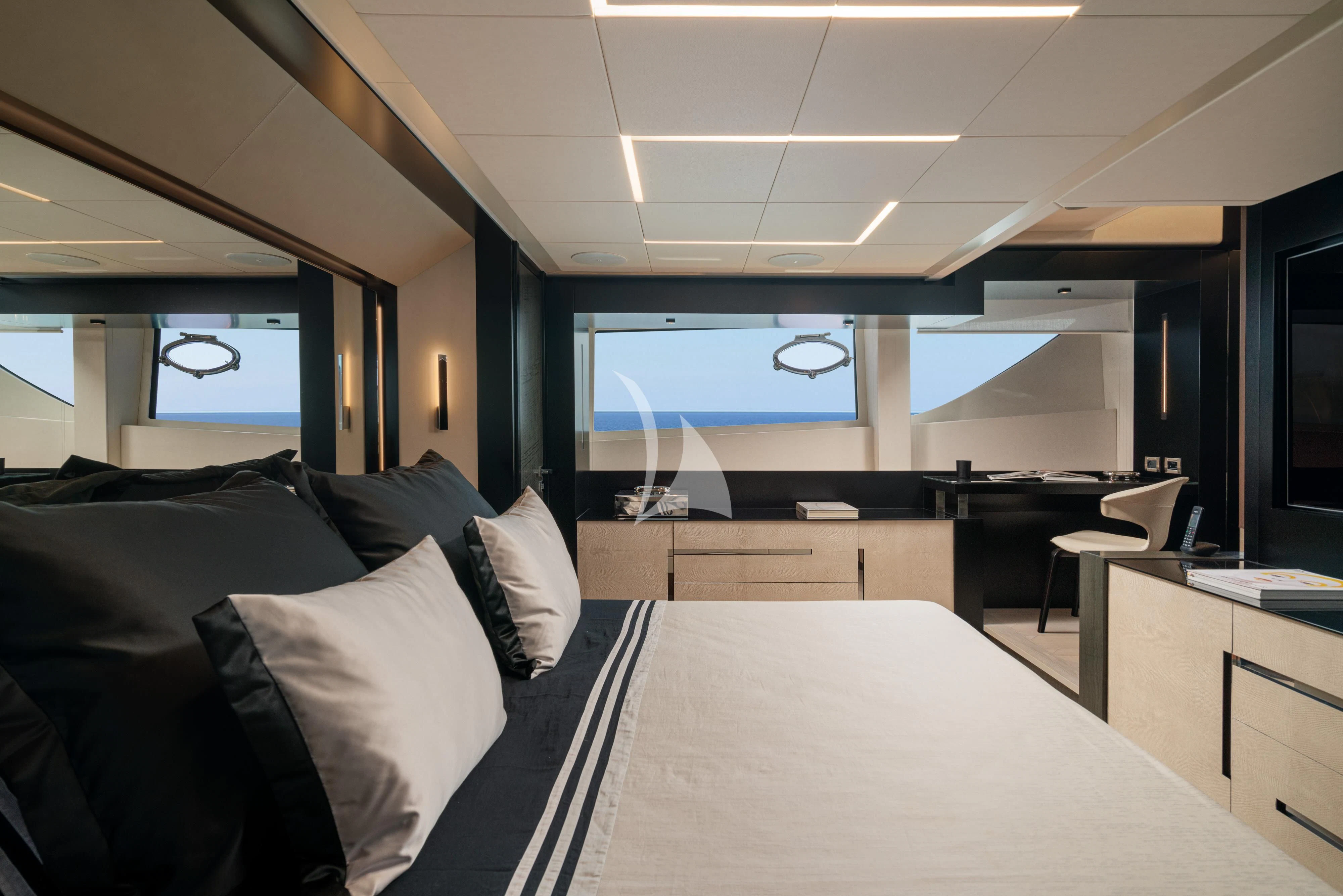 a room with a large bed and a large screen aboard SOPHIA Yacht for Sale
