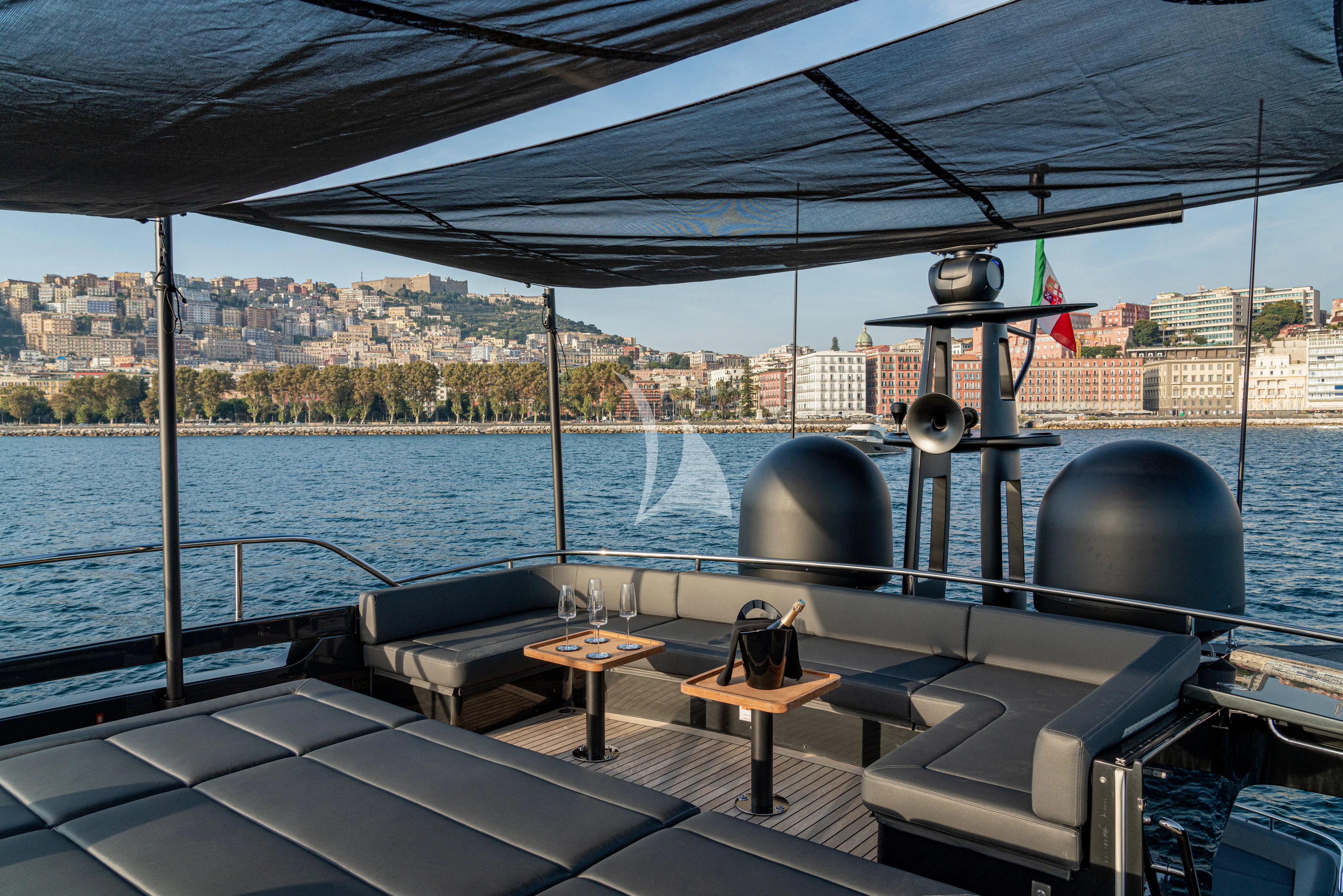 a deck with a view of a city and water aboard SOPHIA Yacht for Sale