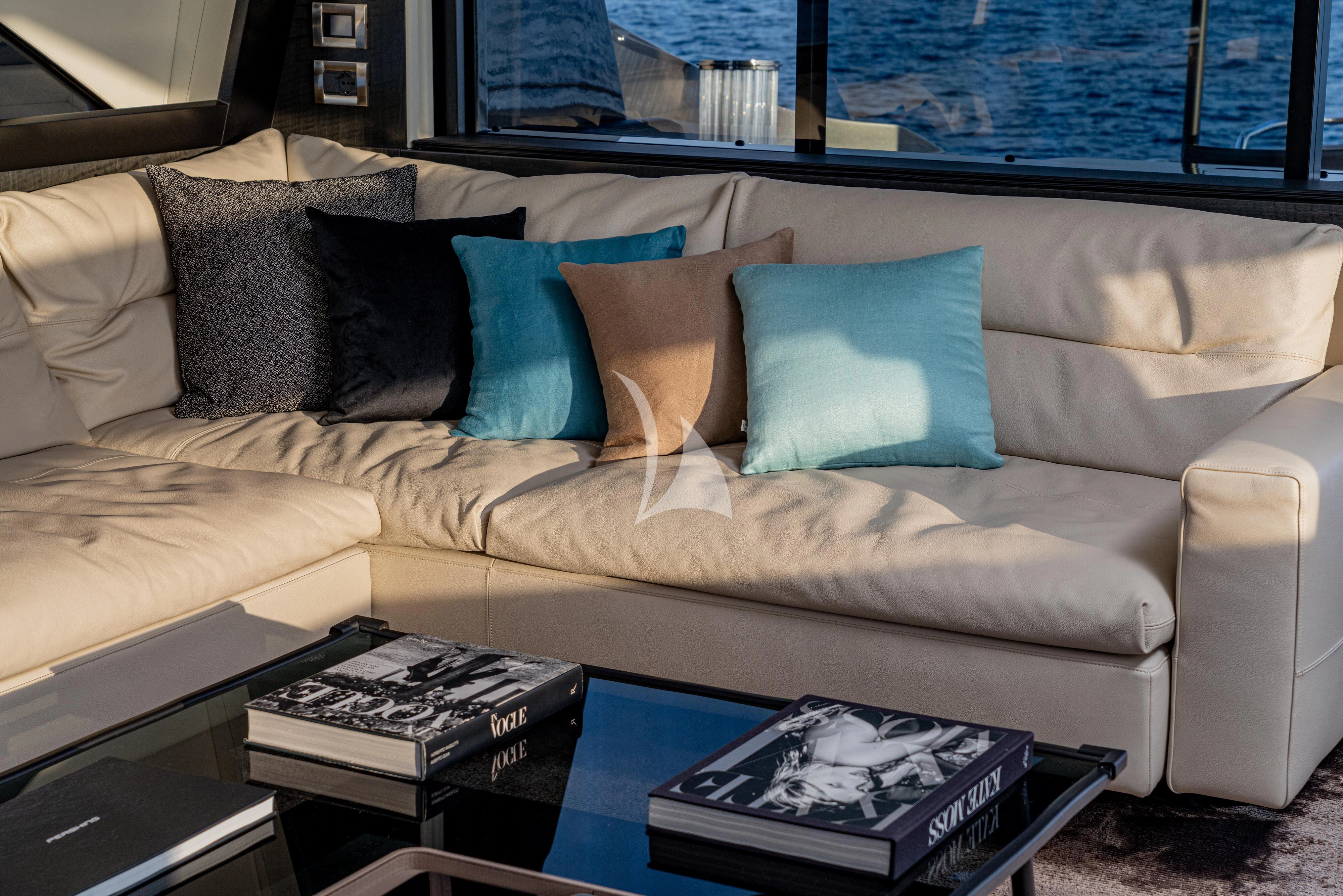 a couch with pillows and pillows aboard SOPHIA Yacht for Sale