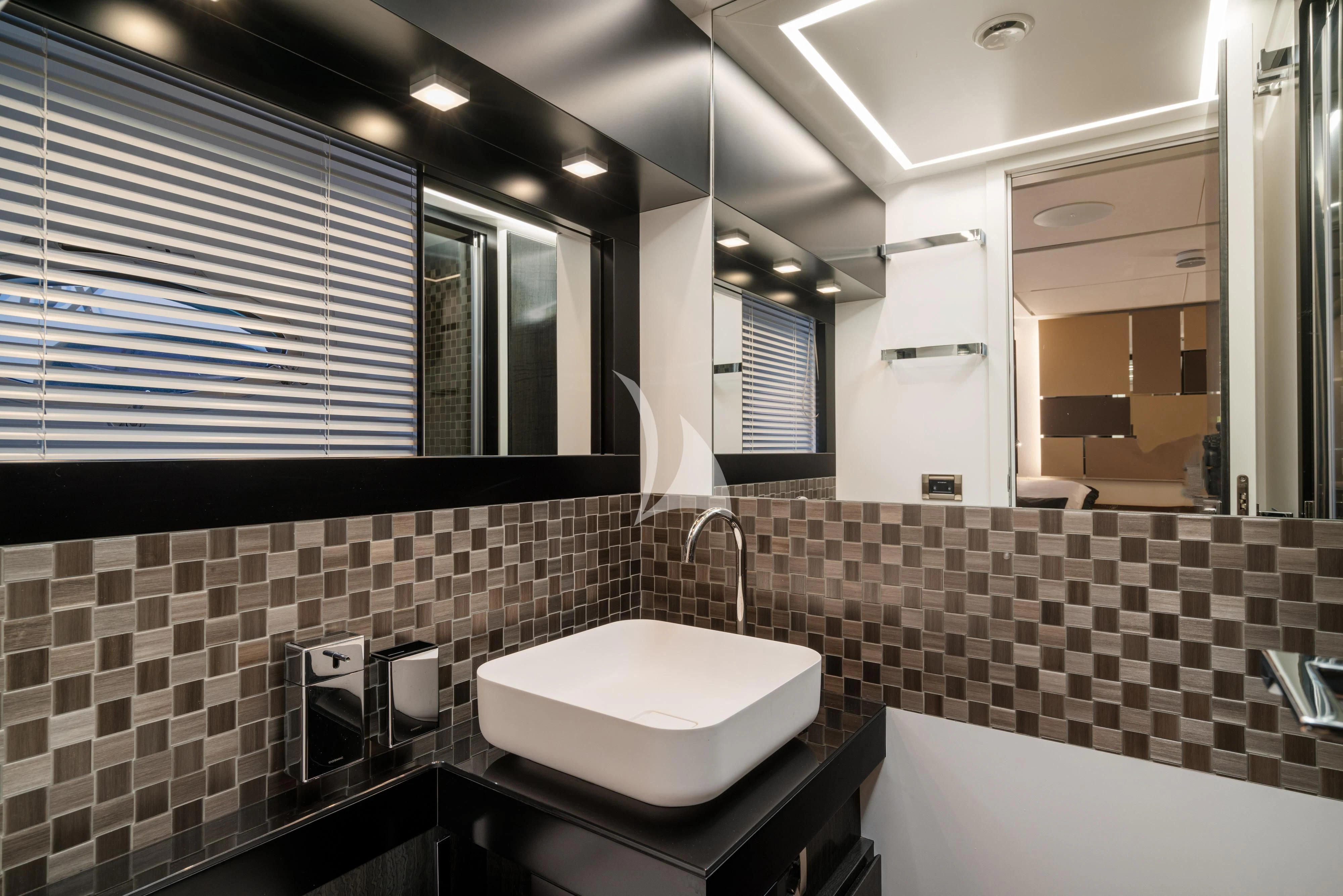 a bathroom with a sink and a mirror aboard SOPHIA Yacht for Sale