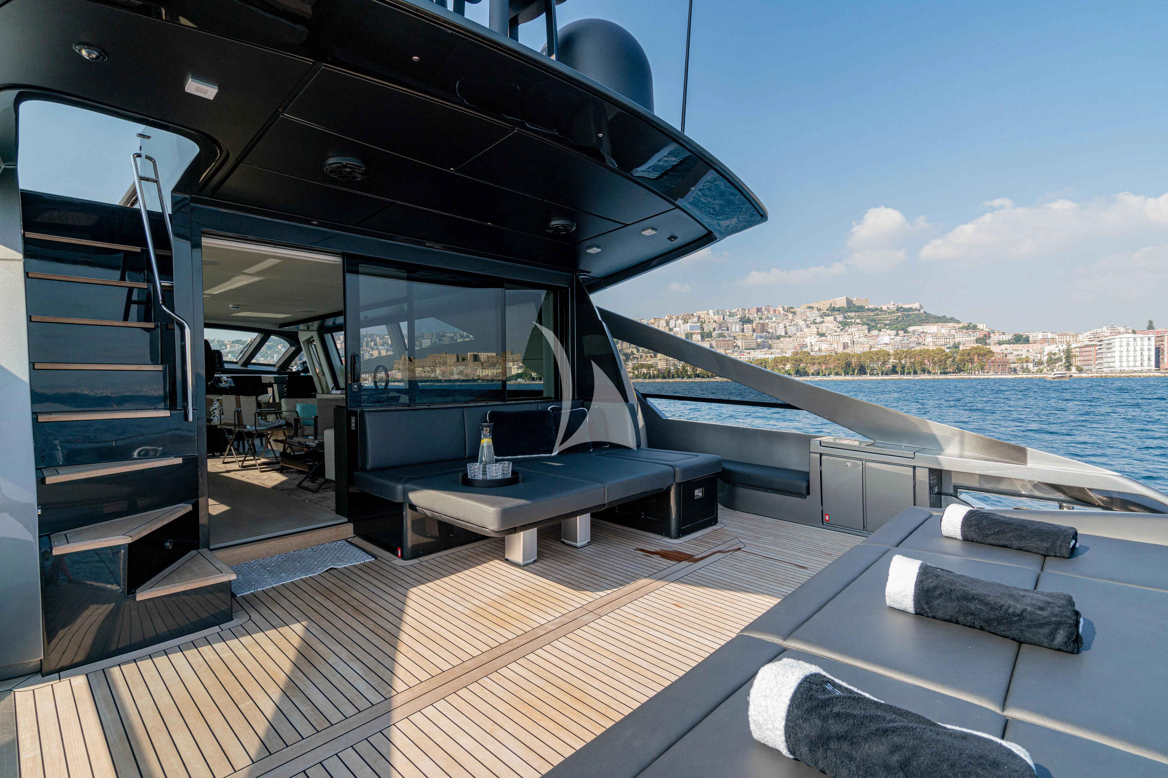 a deck with a view of a city and water aboard SOPHIA Yacht for Sale