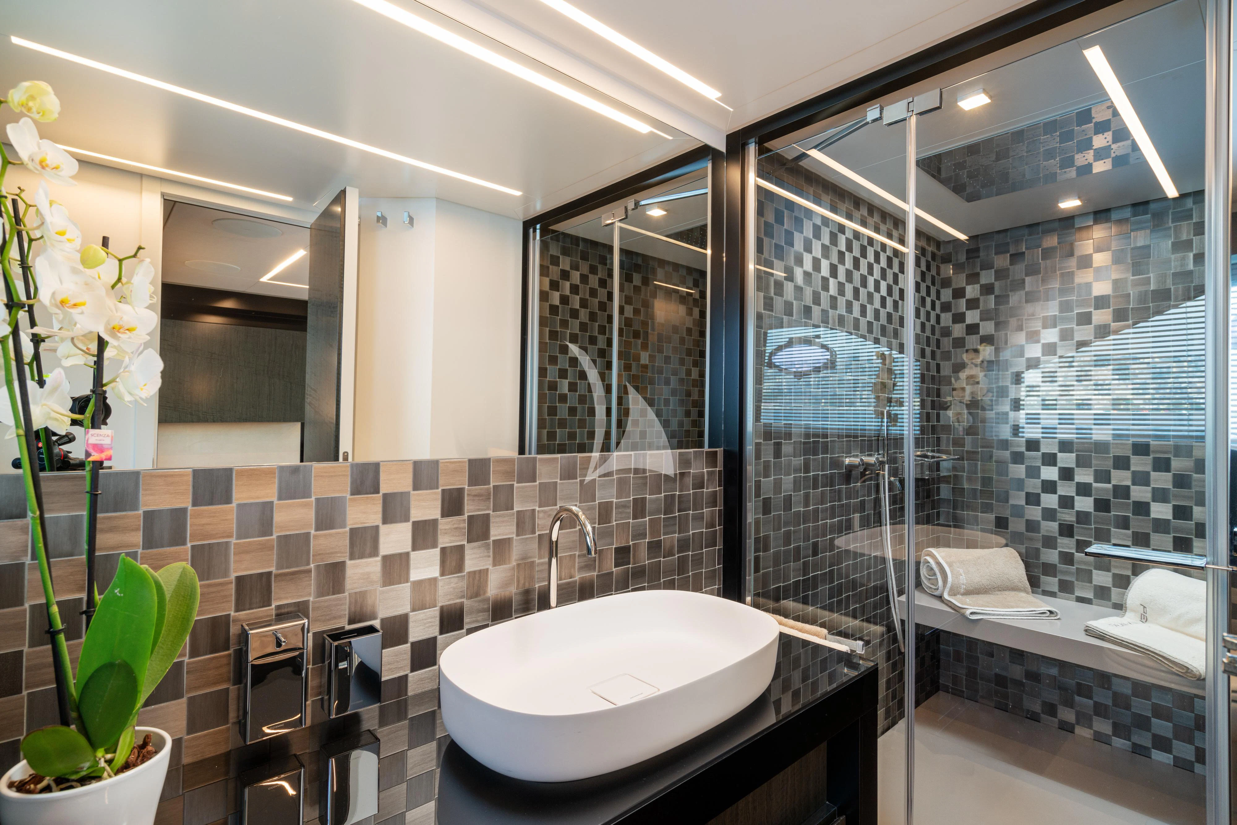 a bathroom with a large mirror aboard SOPHIA Yacht for Sale
