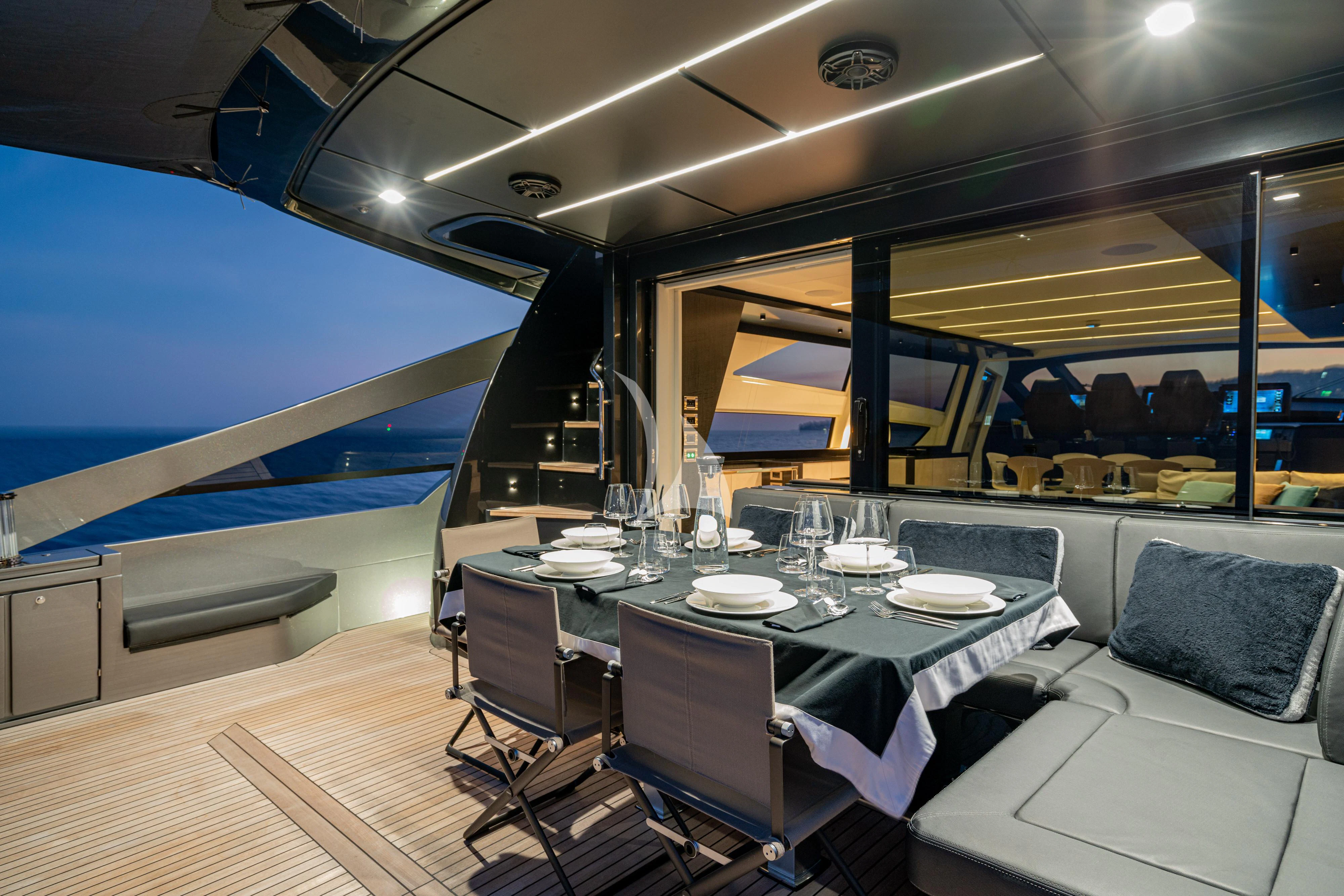 a room with a table and chairs aboard SOPHIA Yacht for Sale