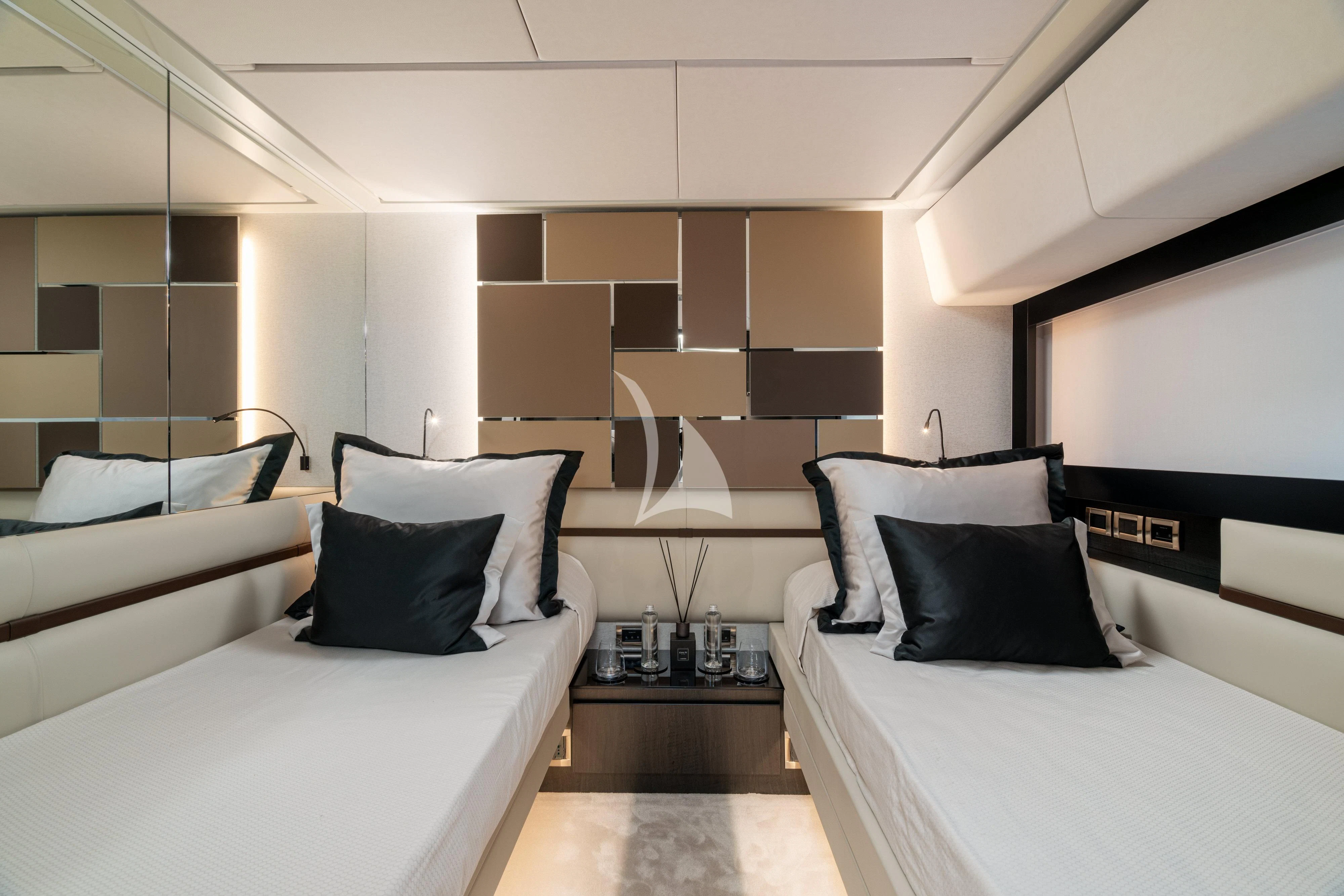 a room with beds and a mirror aboard SOPHIA Yacht for Sale