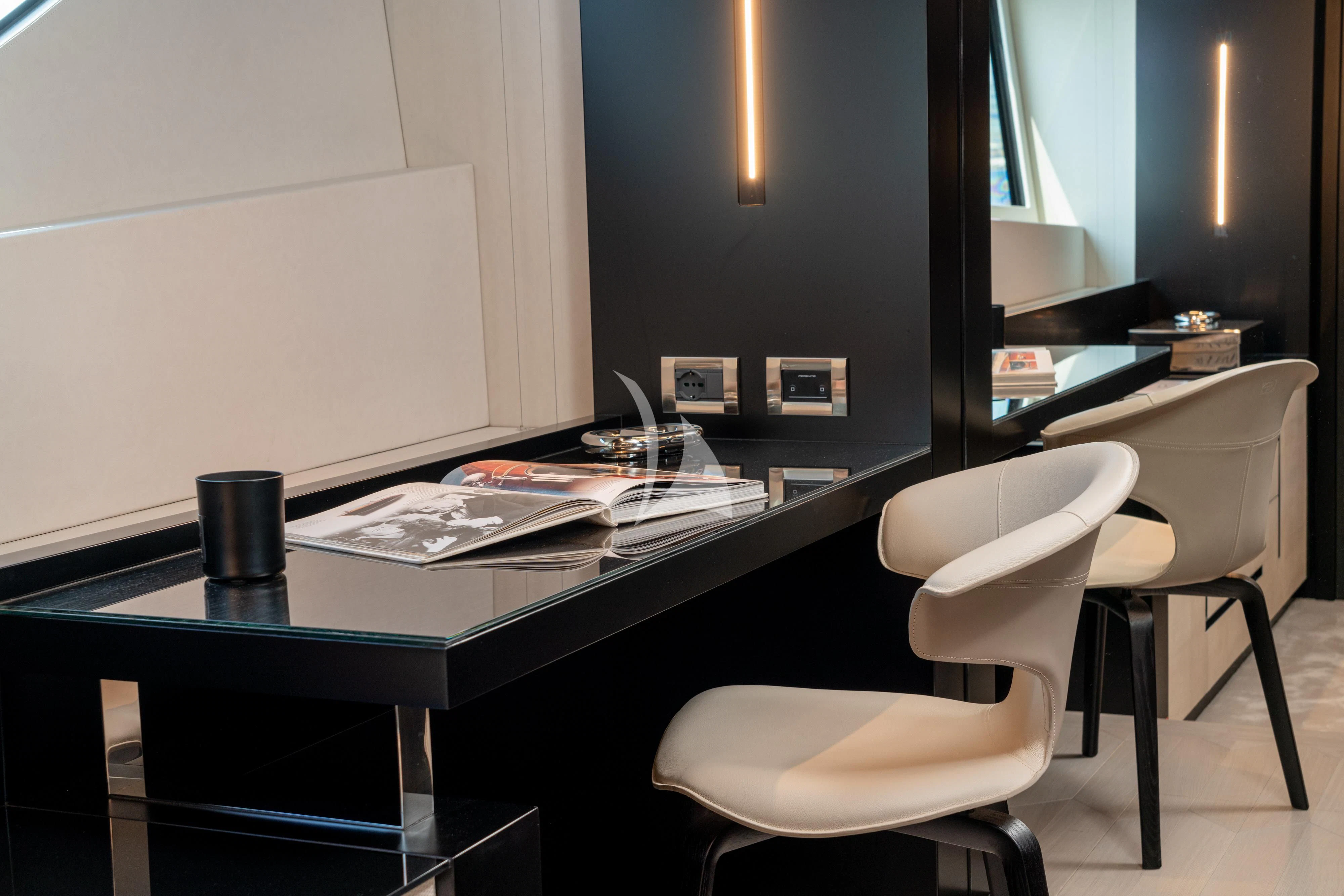 a table with chairs and a white board aboard SOPHIA Yacht for Sale