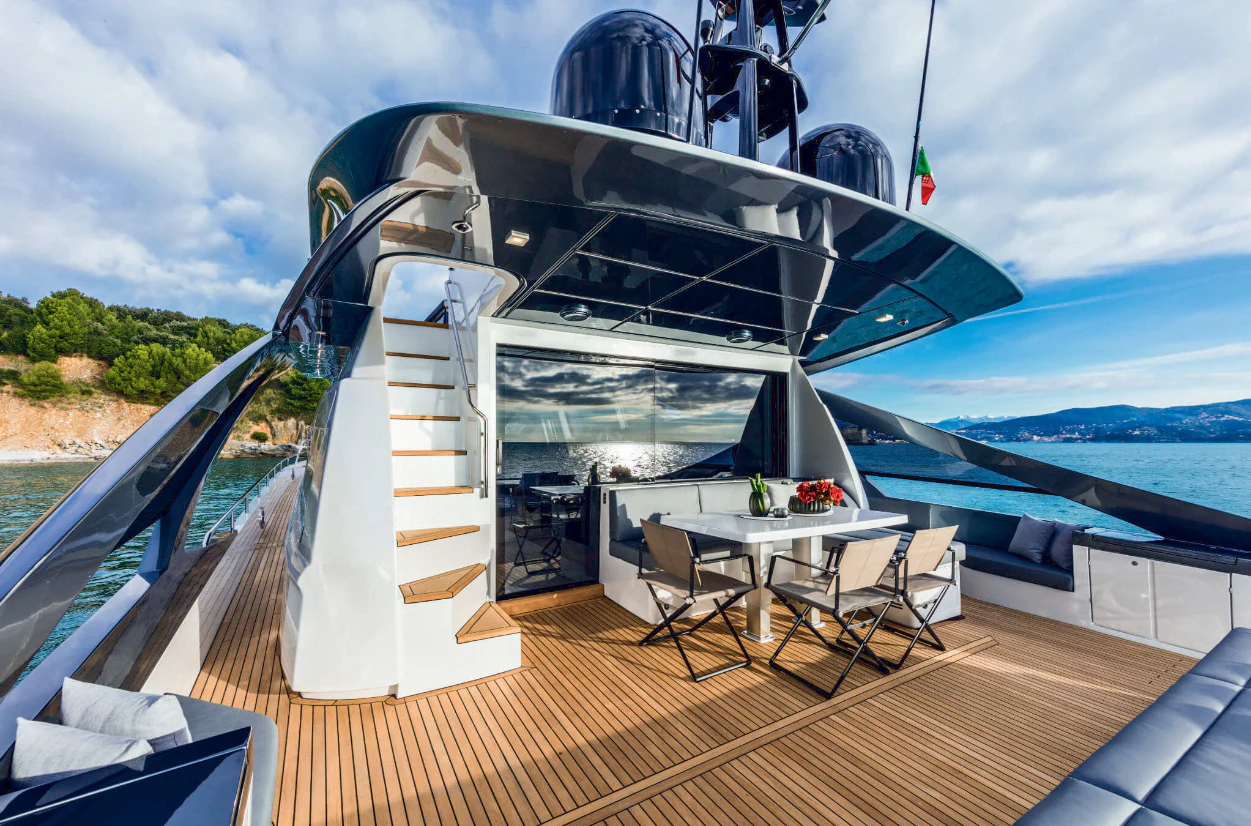 a deck with a table and chairs on it aboard SOPHIA Yacht for Sale